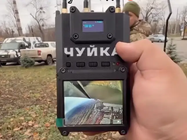 A Ukrainian man holds a Chuika detector.