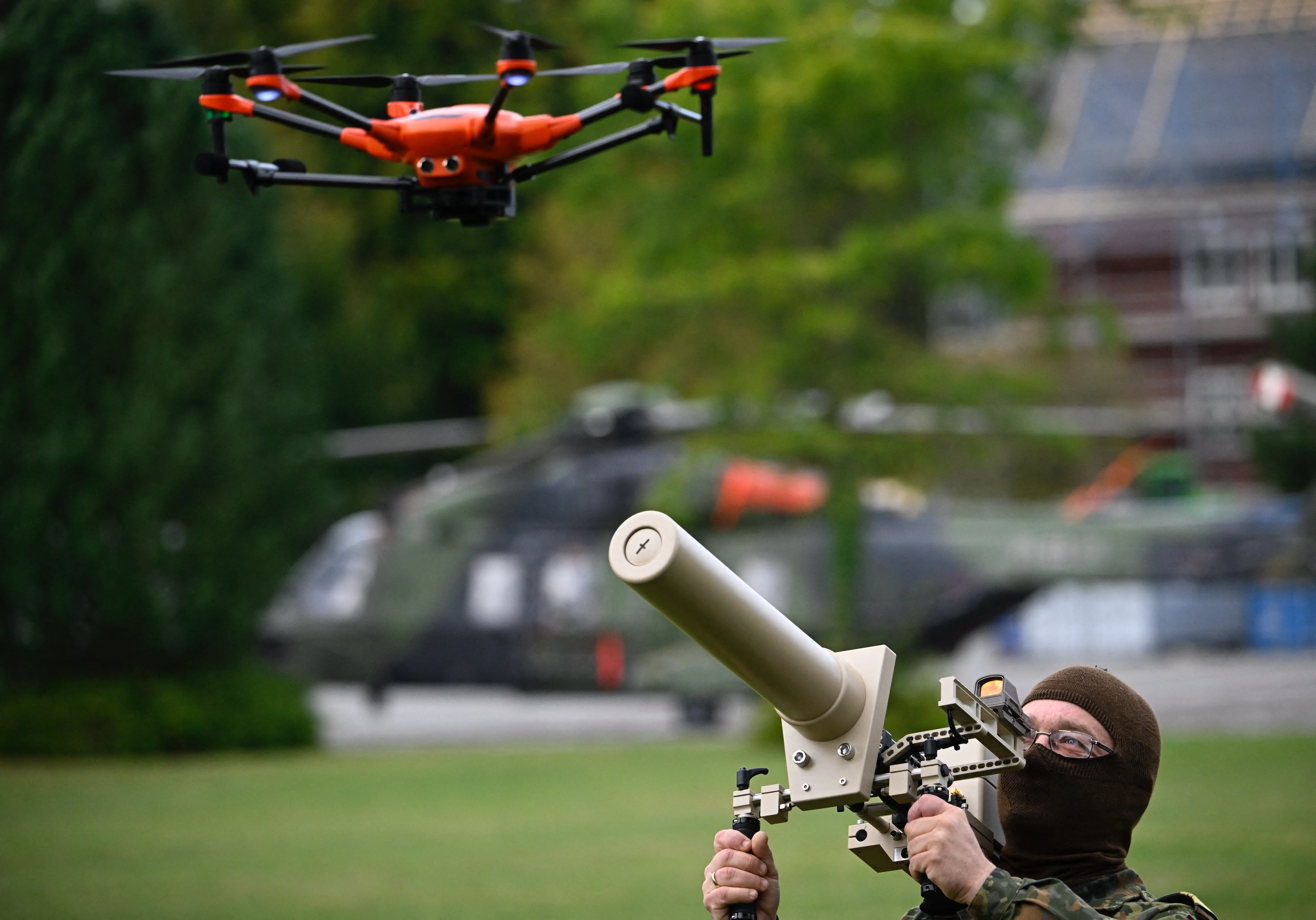 A German soldier holds an anti-drone weapon.