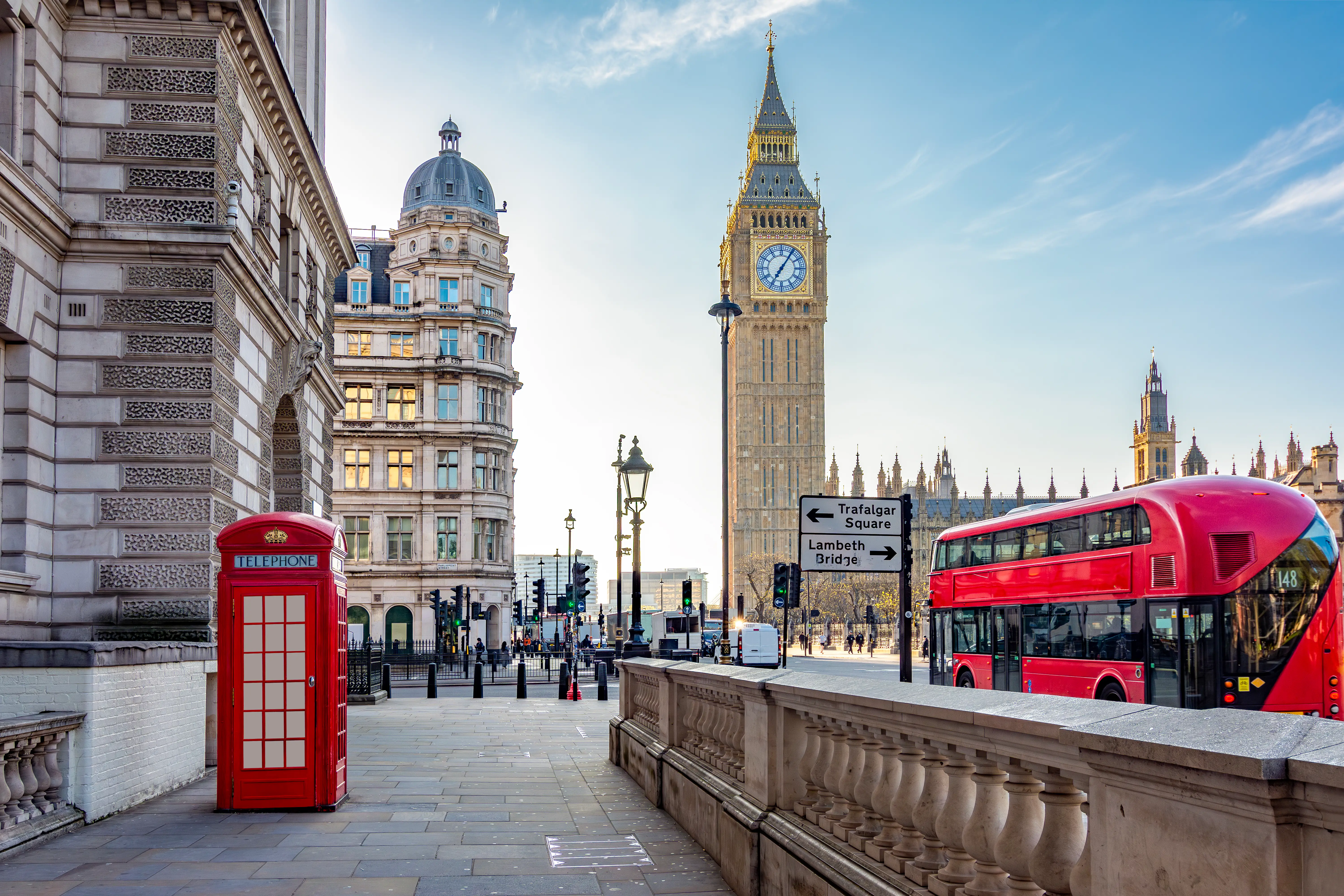 A red telephone box and Big Ben tower, London.