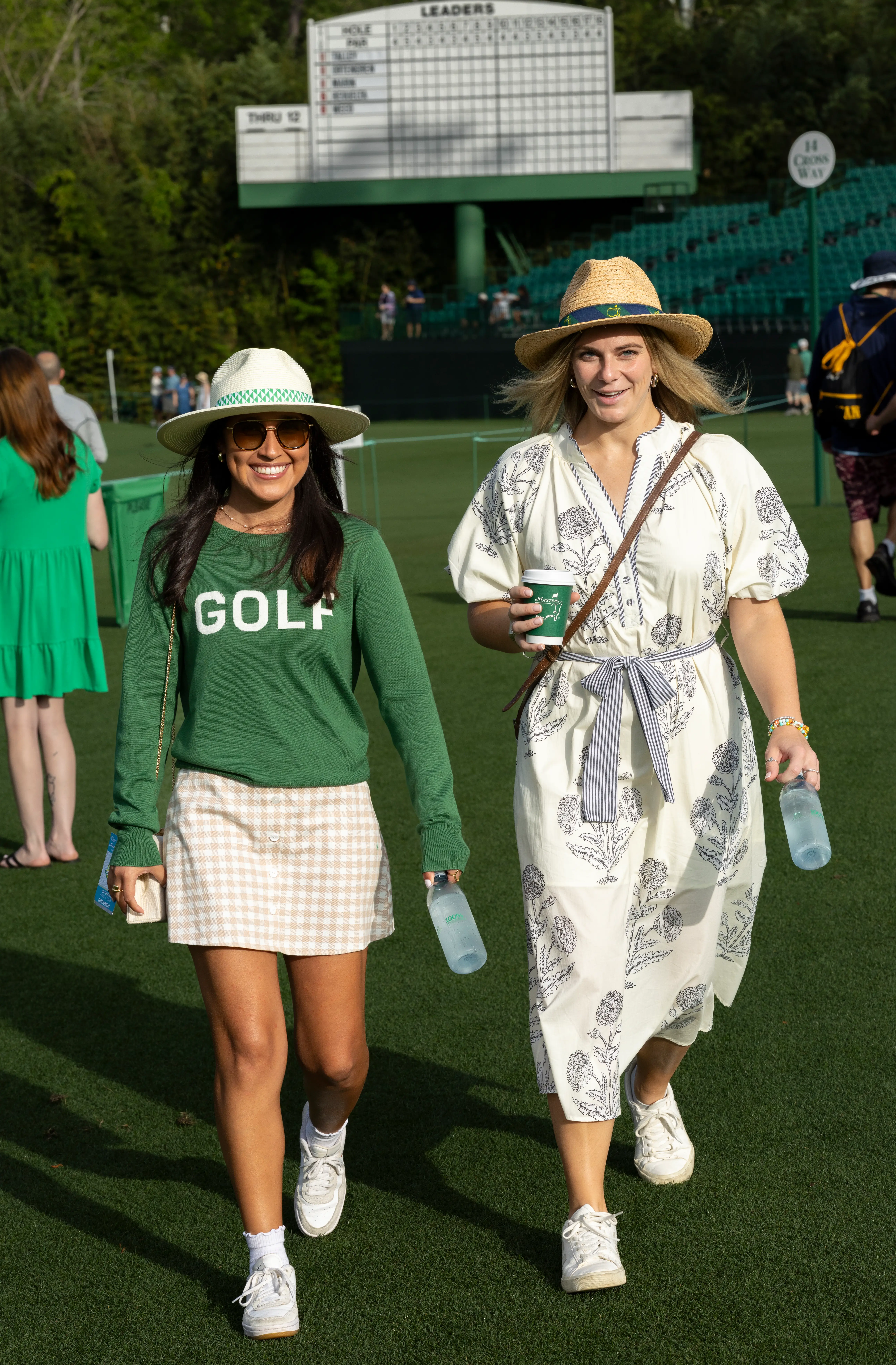 Two people attend the 2026 Masters Tournament in Augusta, Georgia.