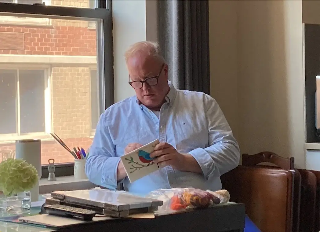 Kevin Lustik doing needlepoint