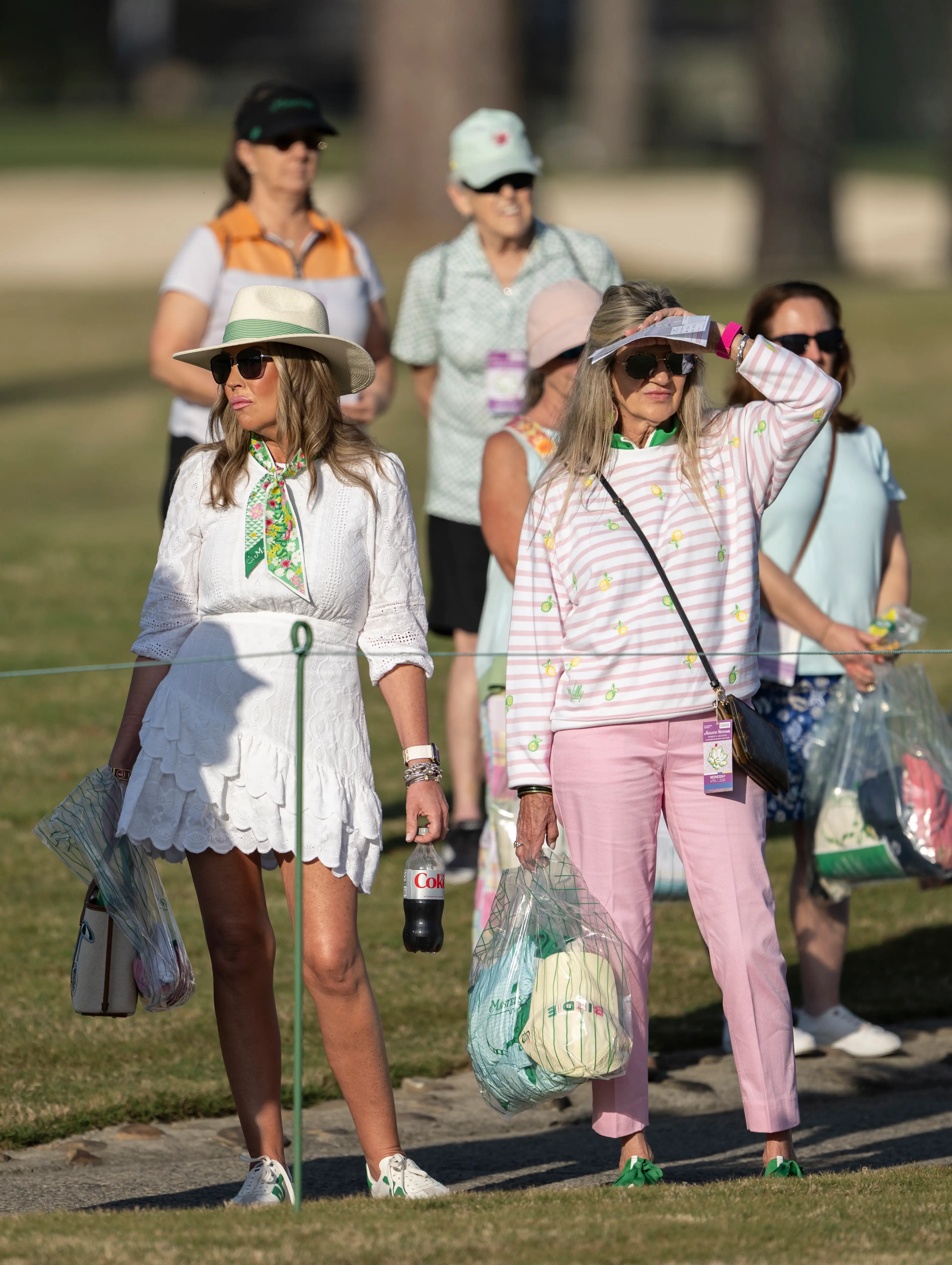 Two women at the 2026 Masters Tournament in Augusta, Georgia.