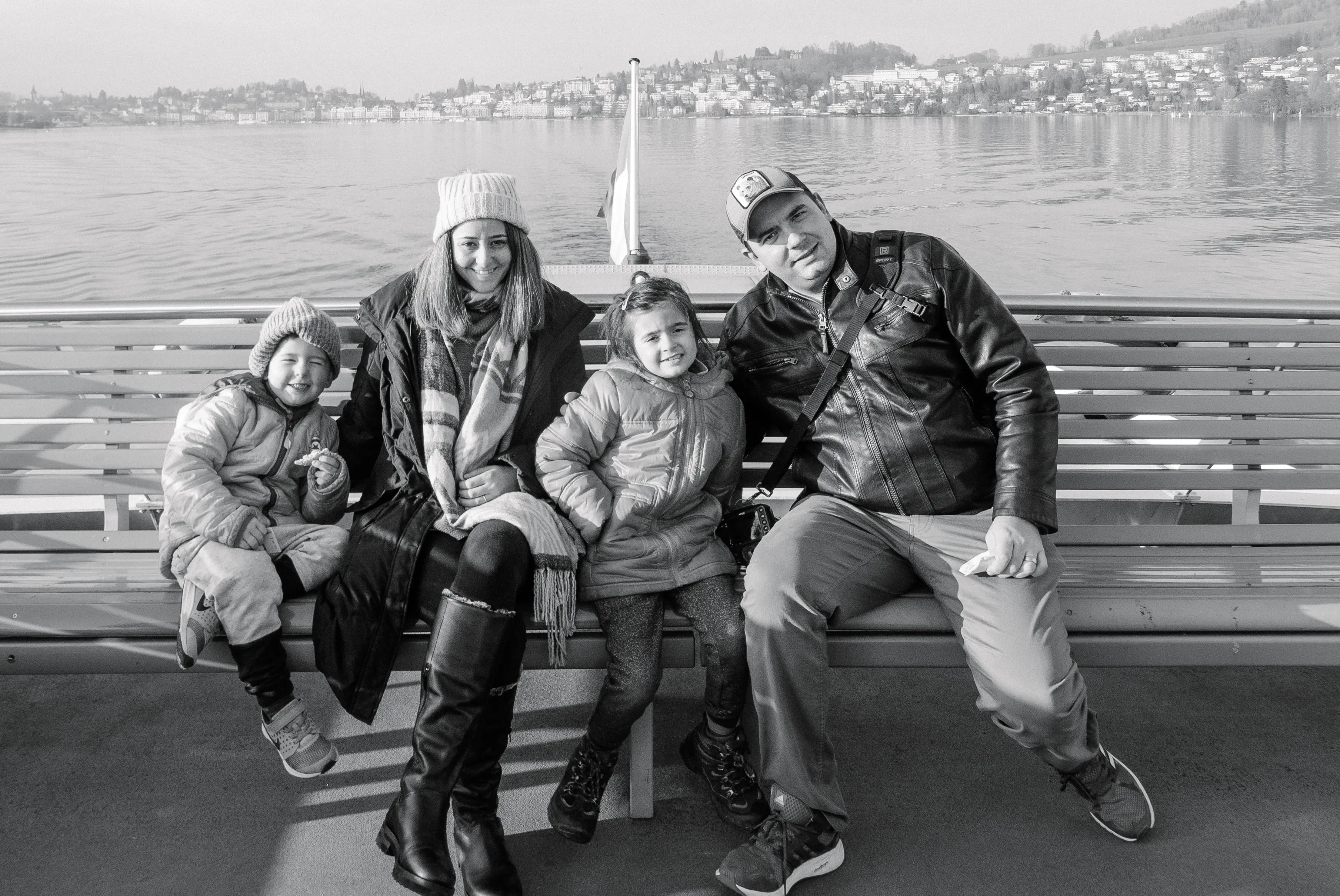 Naomi Tsvirko and her family sitting on a bench
