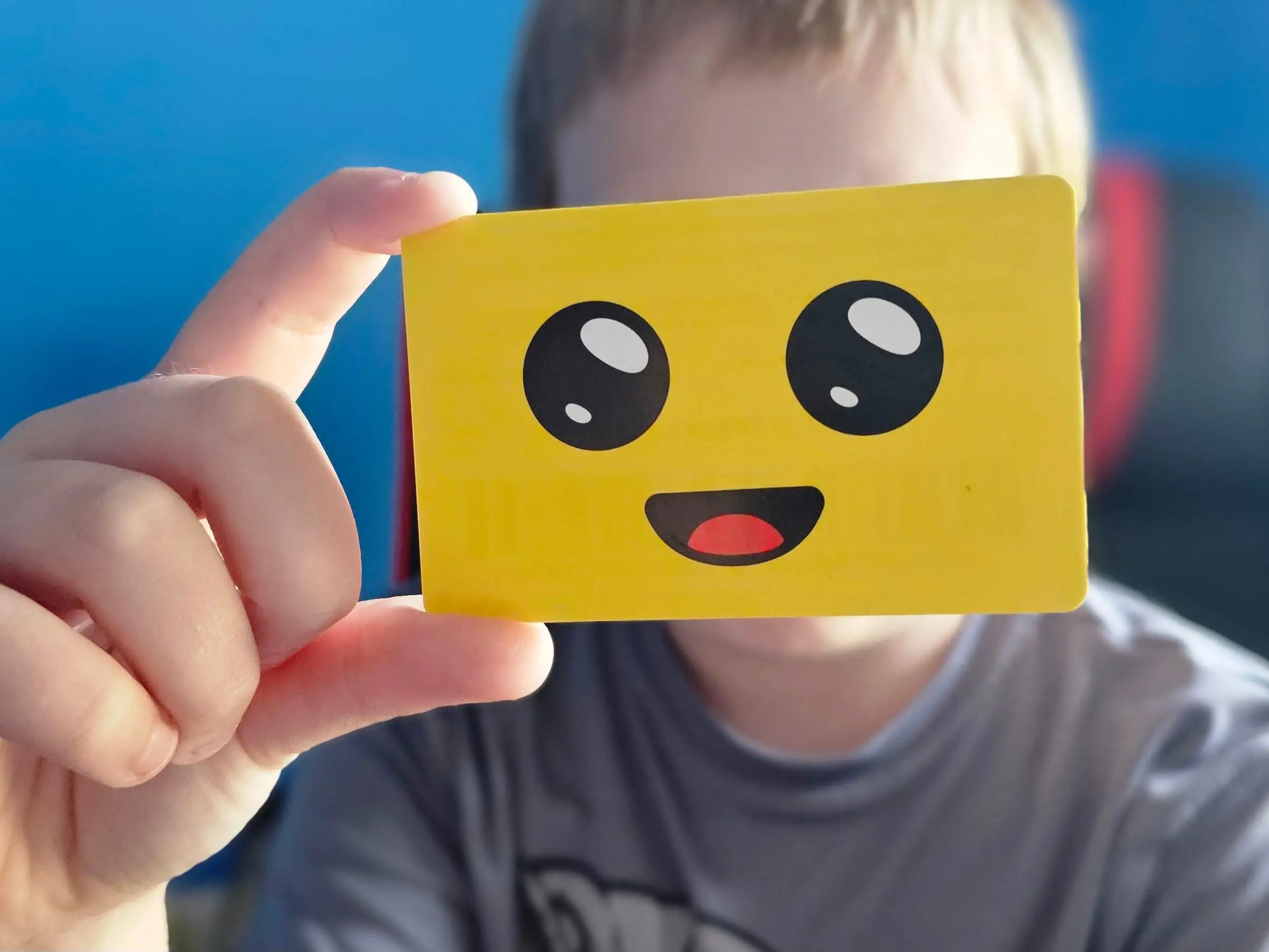 Boy holding fornite card