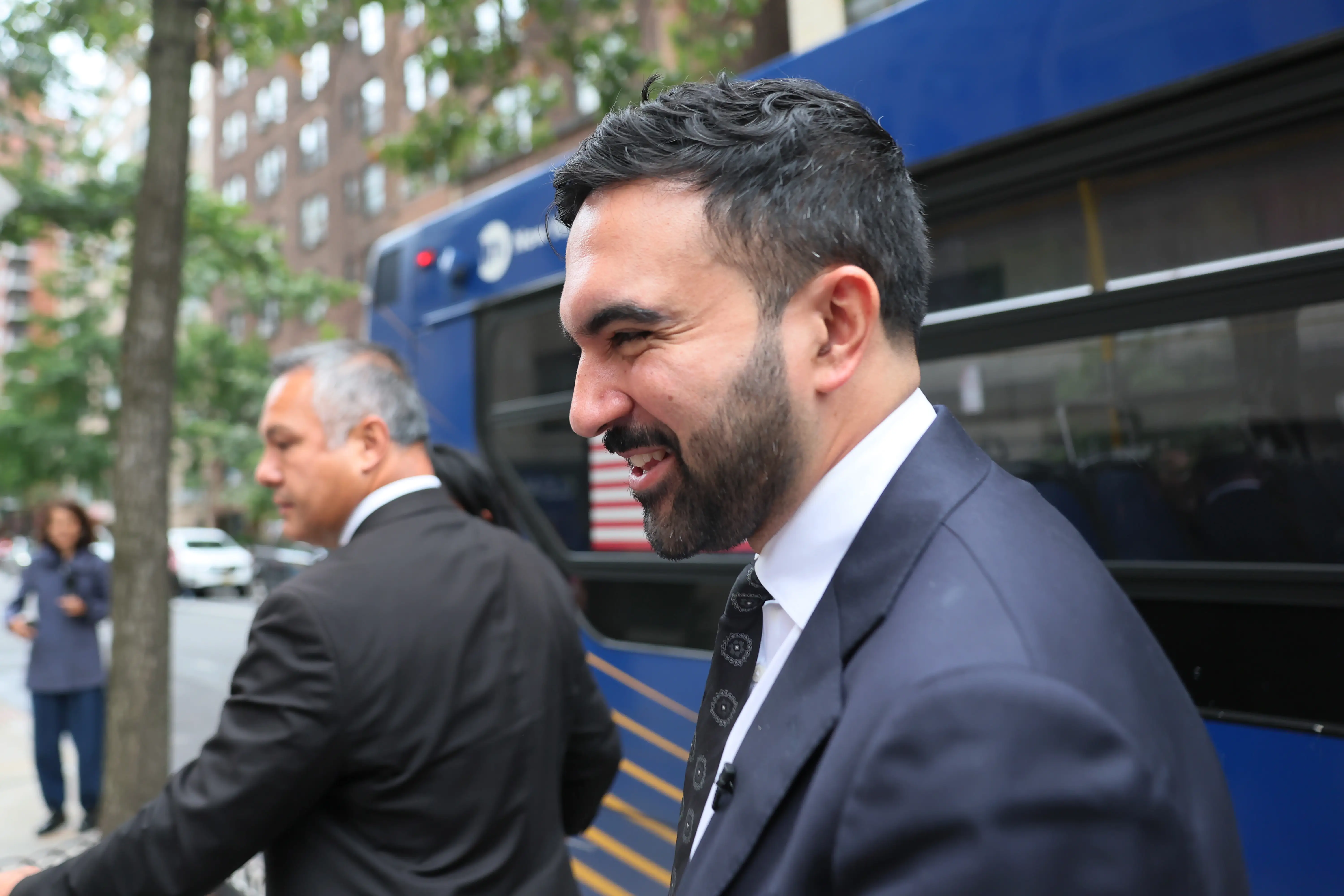 Zohran Mamdani stepping off a new york city bus