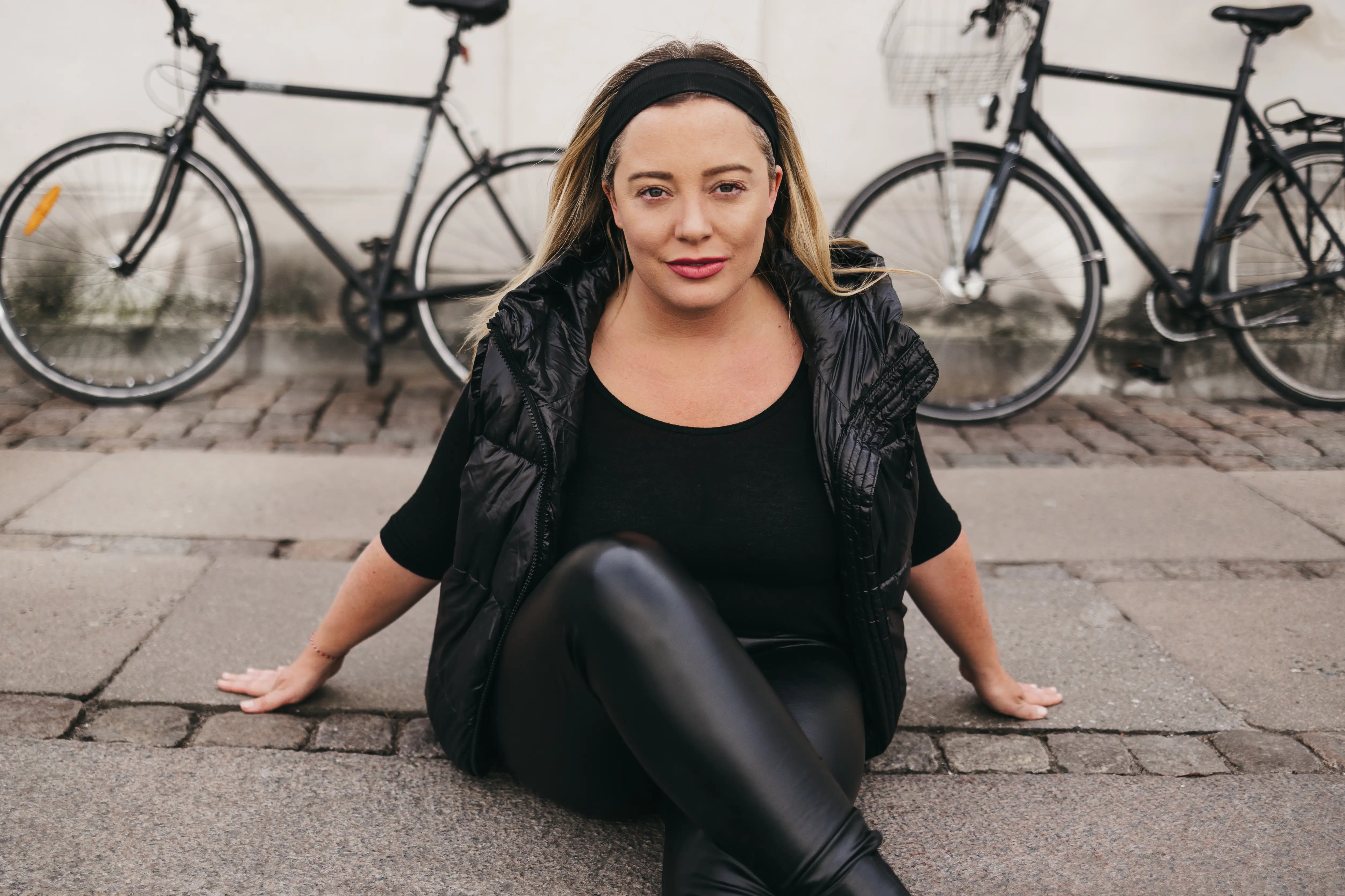 Woman posing in front of bikes