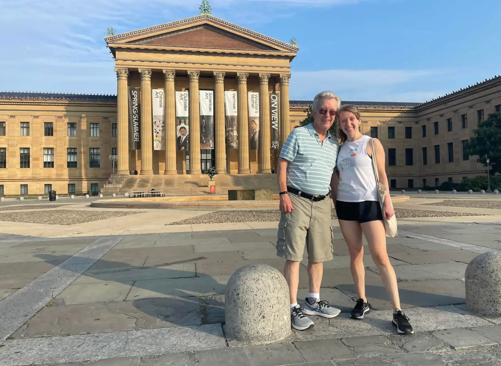 The writer and her dad standing in front of a museum in Philly.