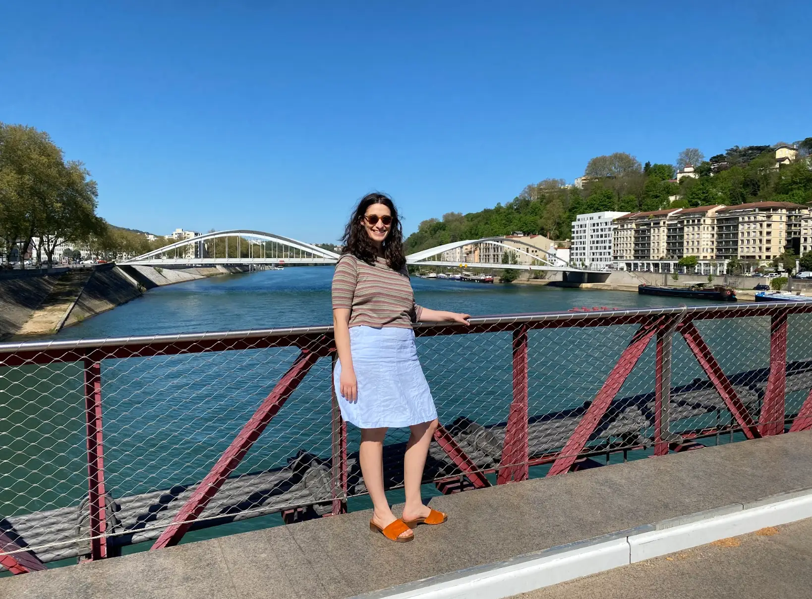 The writer standing on a bridge in Lyon, France.