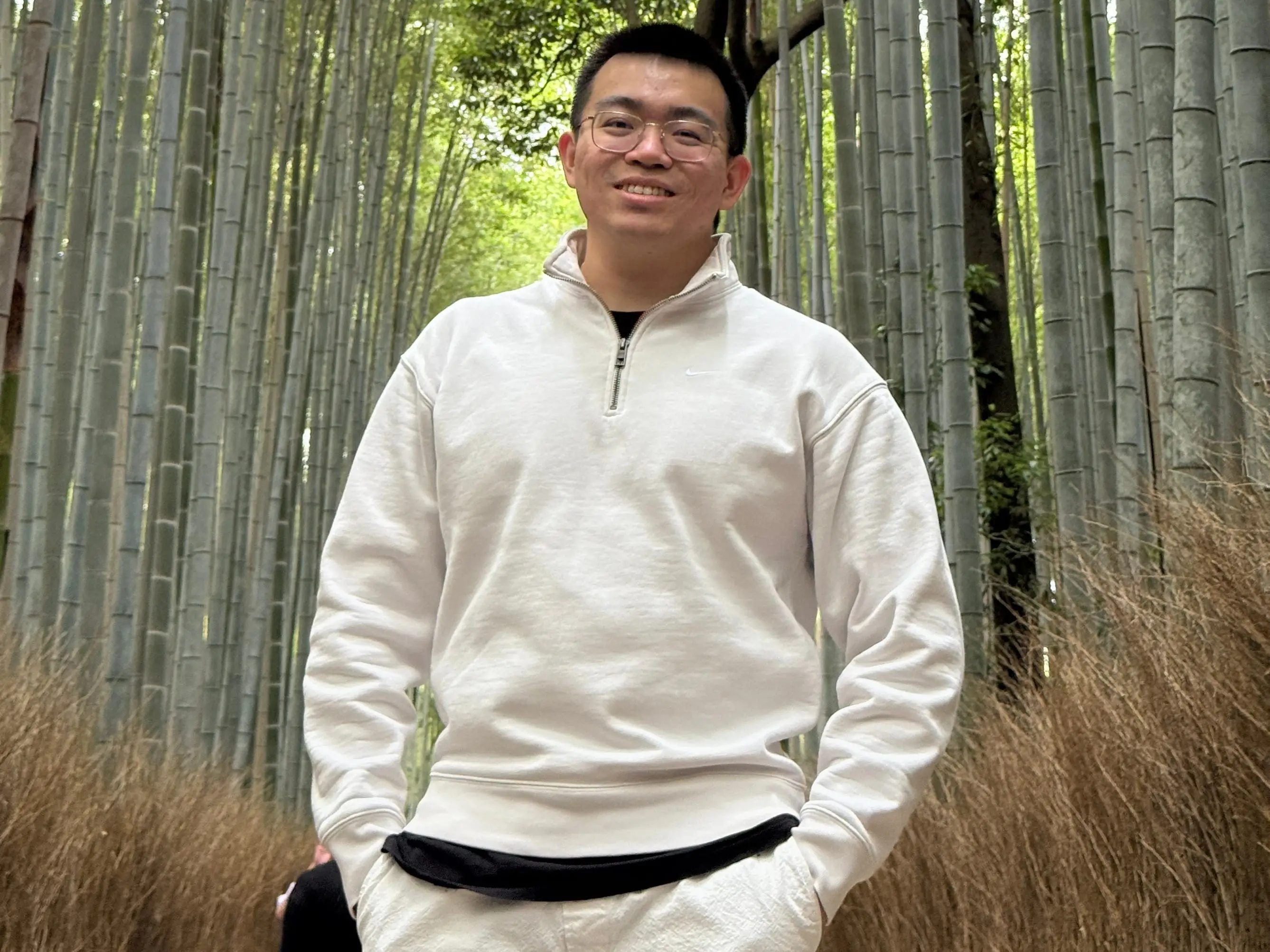 Jason Zhang in front of trees