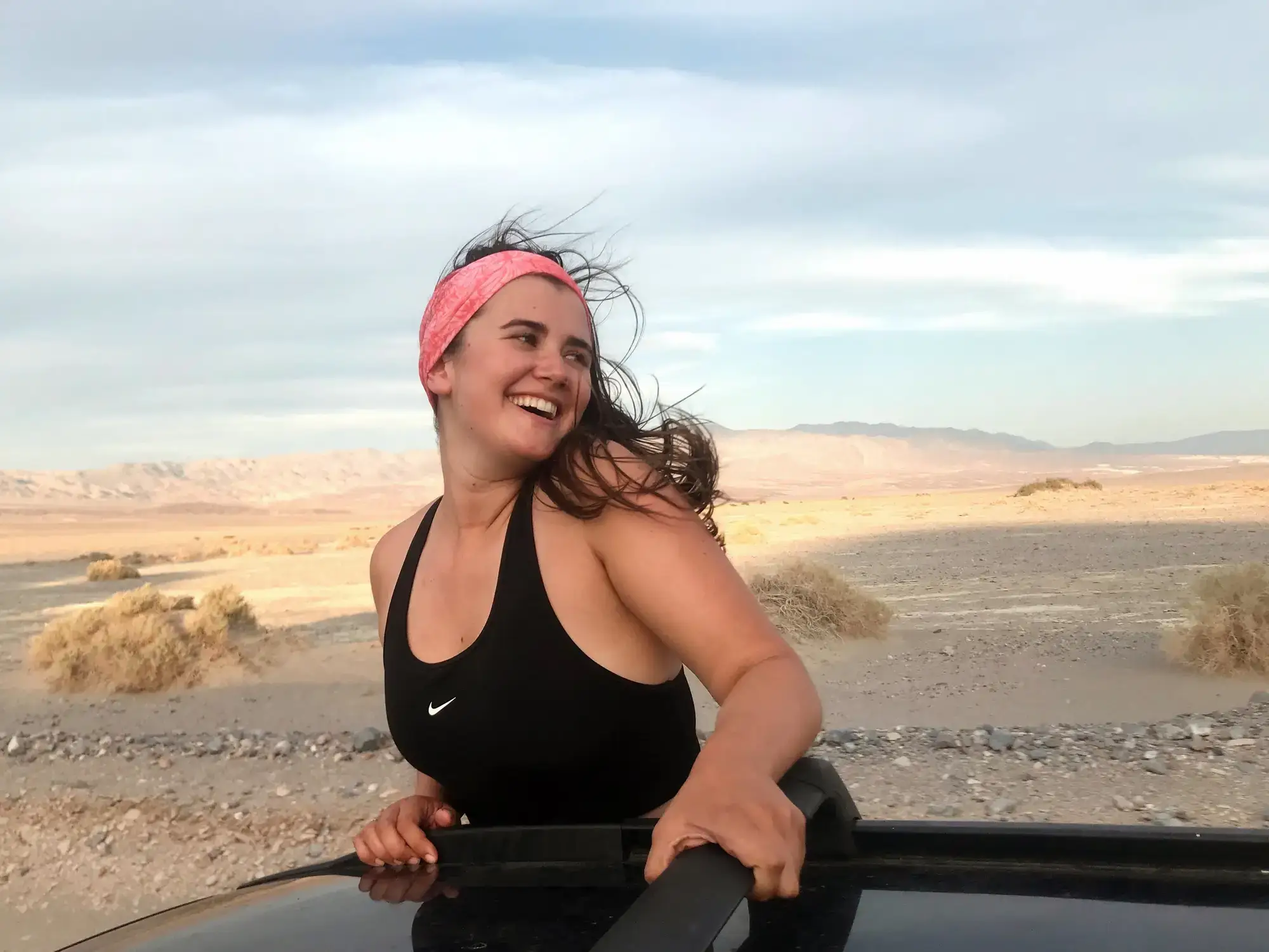 woman in car in the mountains