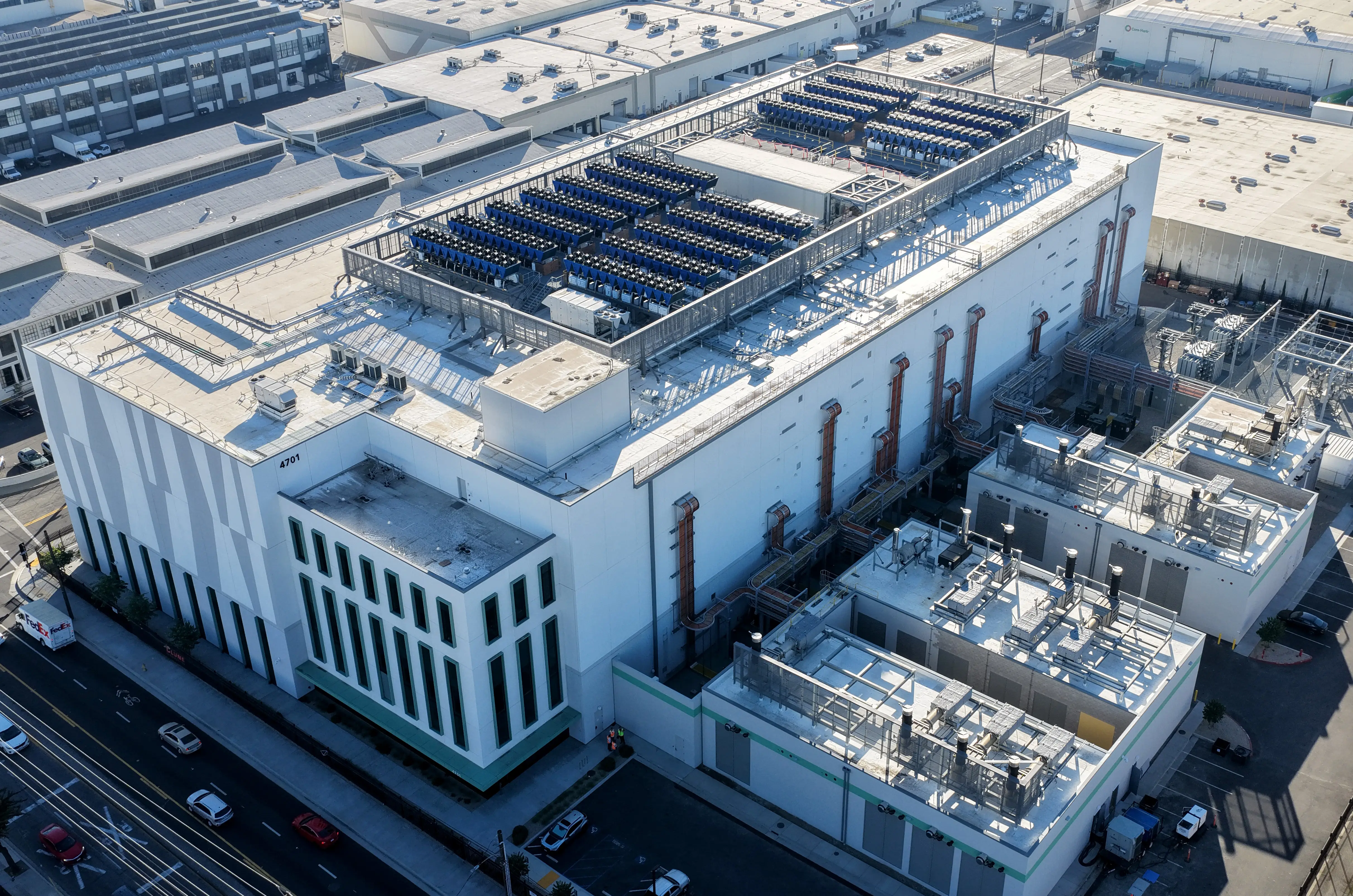An aerial view of a 33 megawatt data center with closed-loop cooling system on October 20, 2025 in Vernon, California. A surge in demand for AI infrastructure is fueling a boom in data centers across the country and around the globe.
