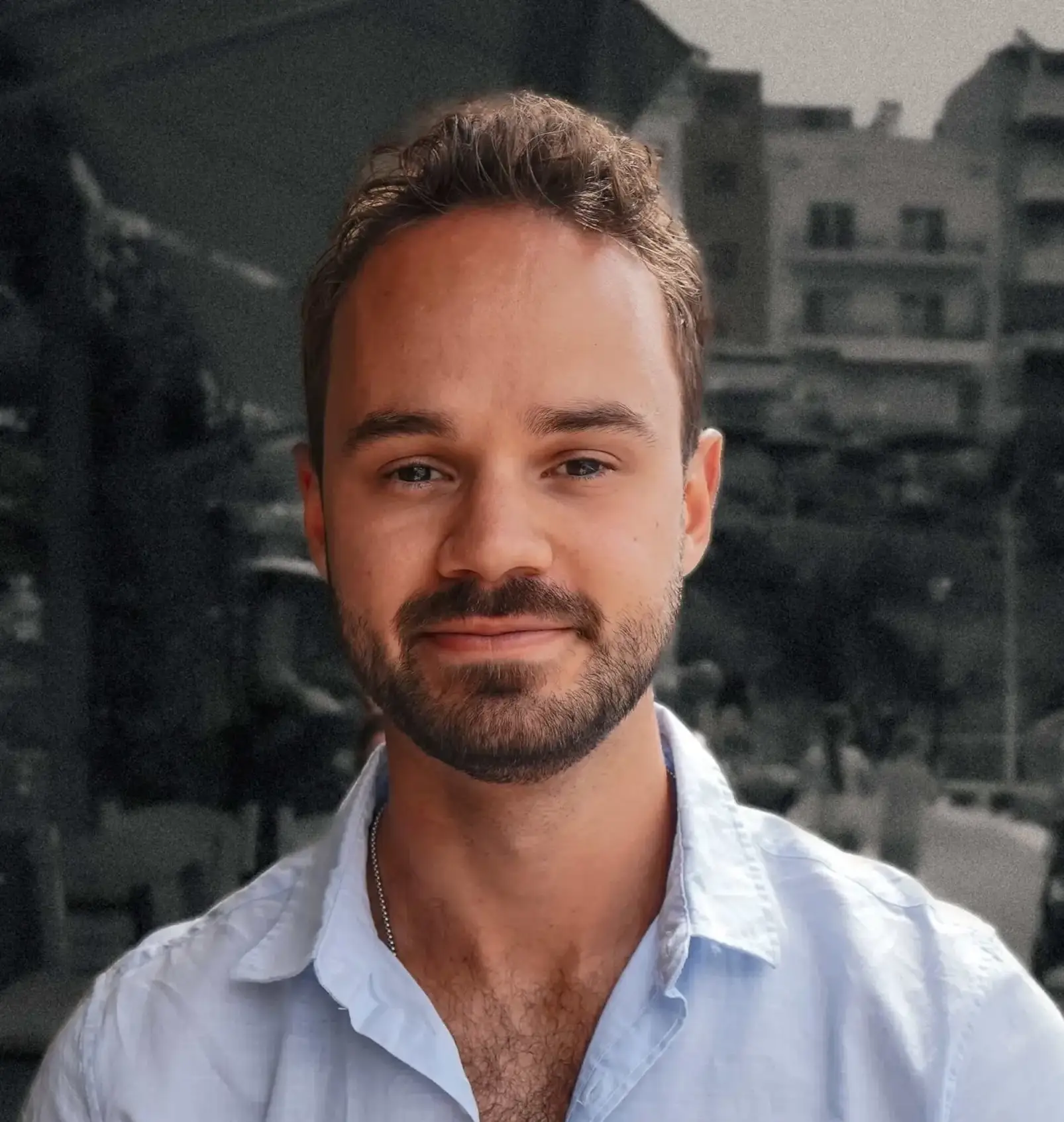 headshot of a man with a black and white background