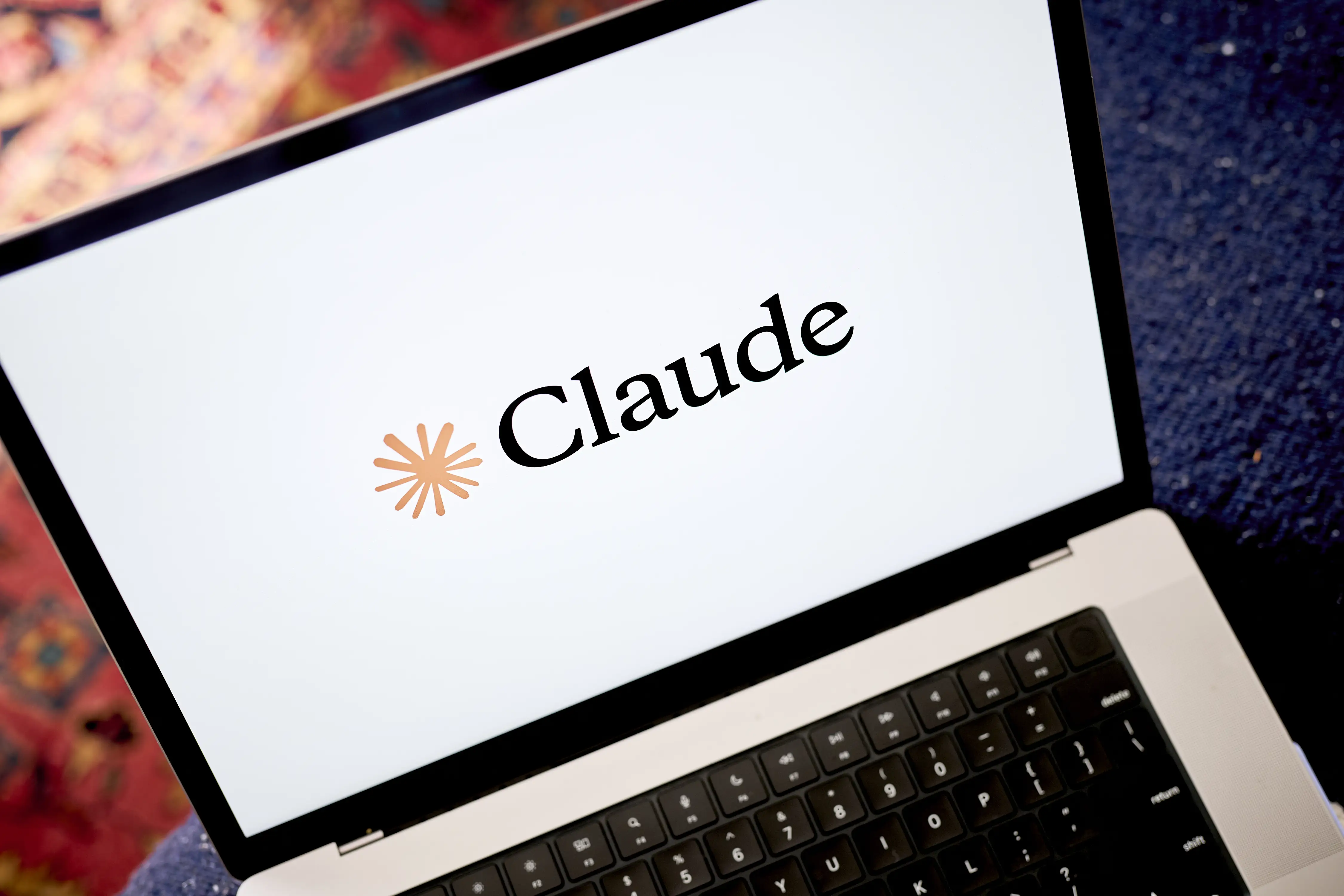 The Anthropic Claude logo arranged on a laptop