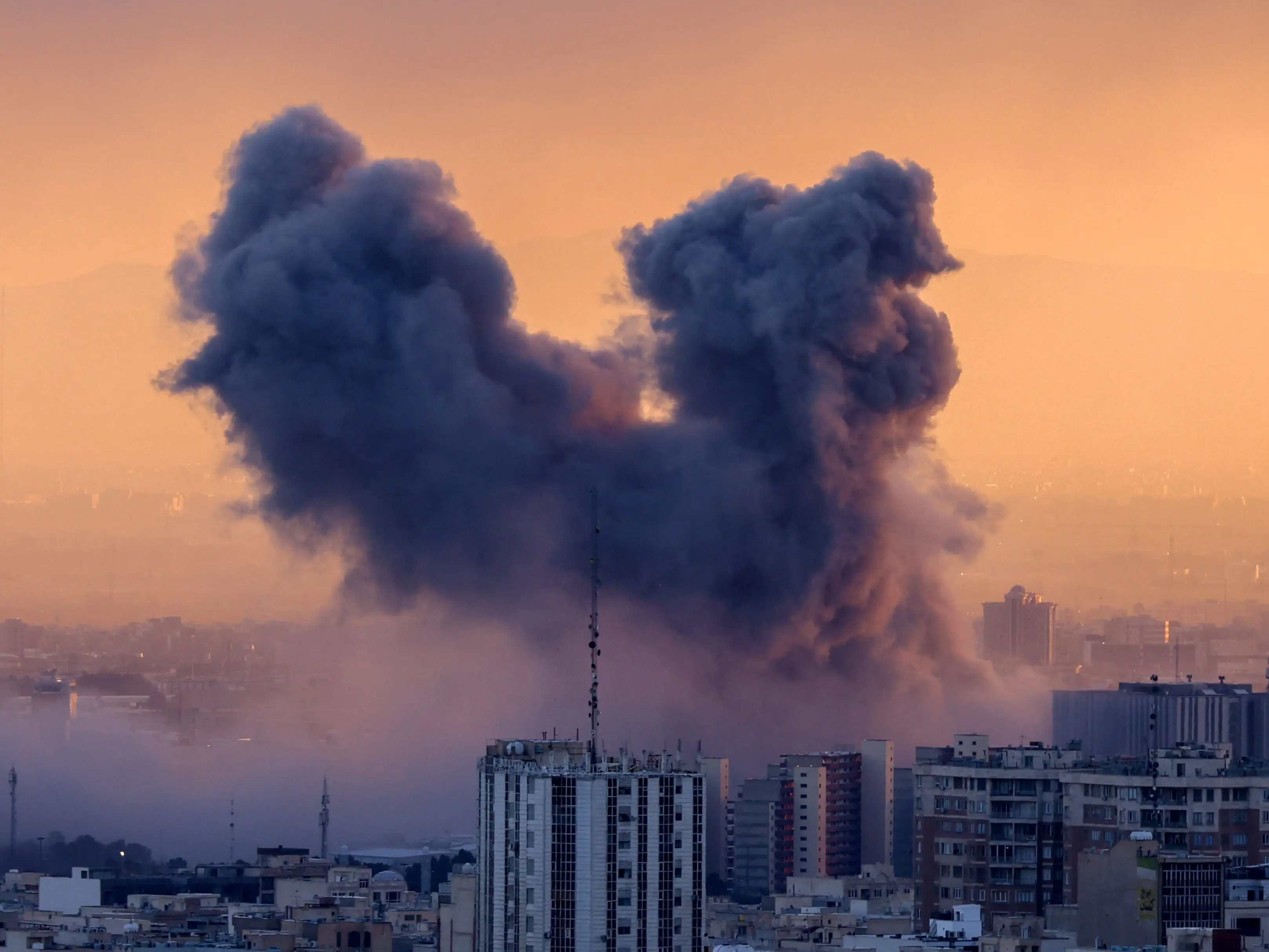 A plume of smoke rises above Tehran after a strike on March 3.