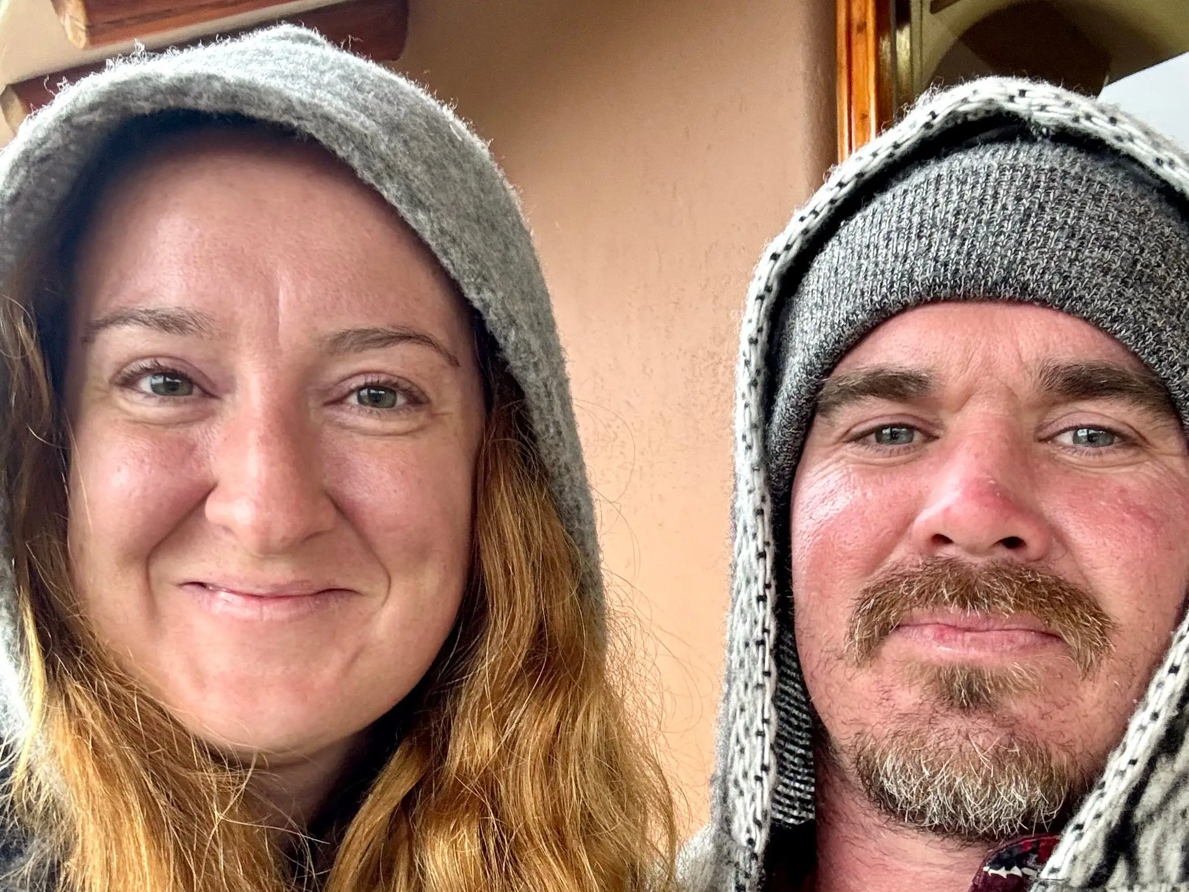 Brother and sister wearing sweaters.