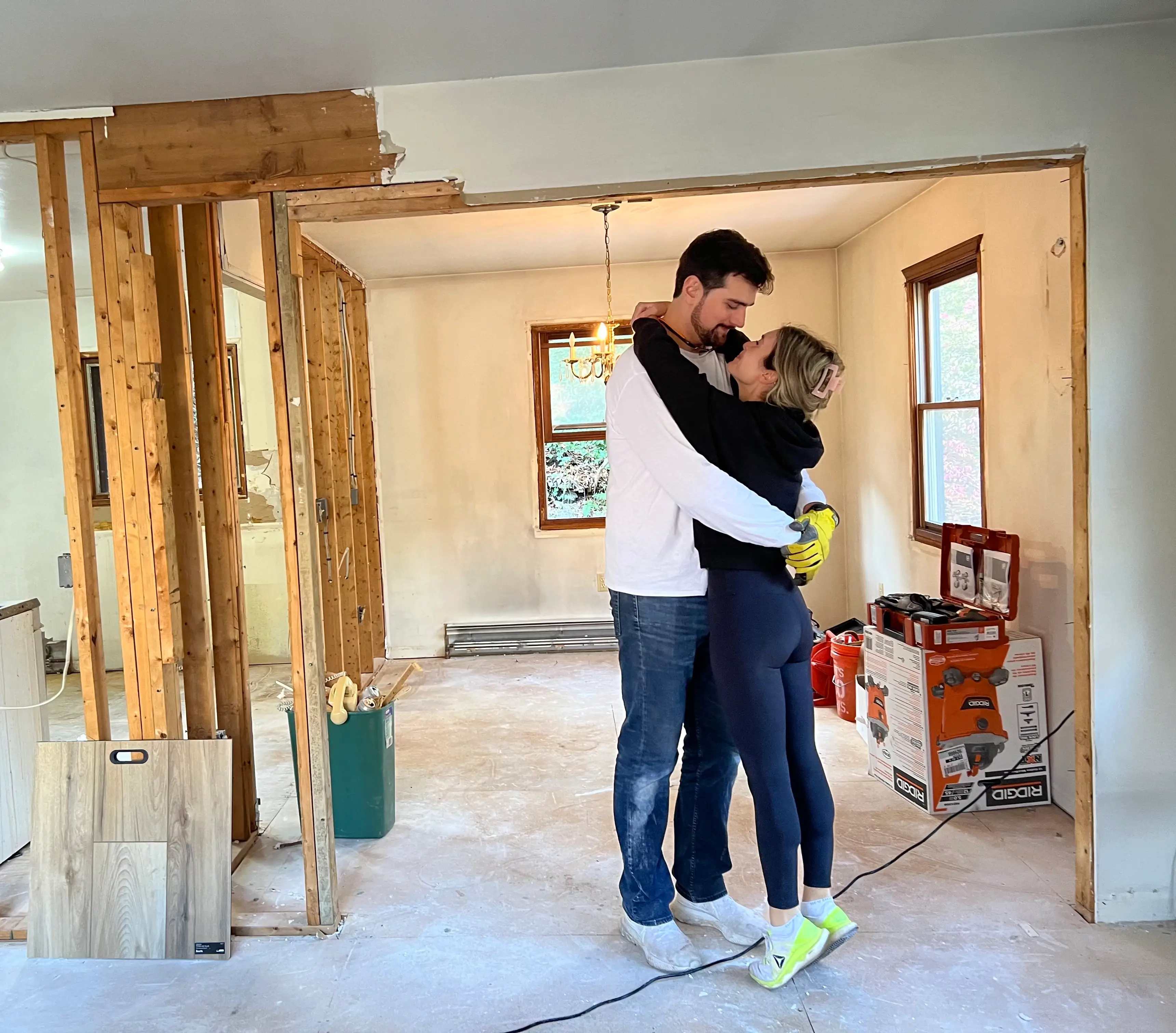 Alexa Mellardo and her husband in their kitchen mid-renovation
