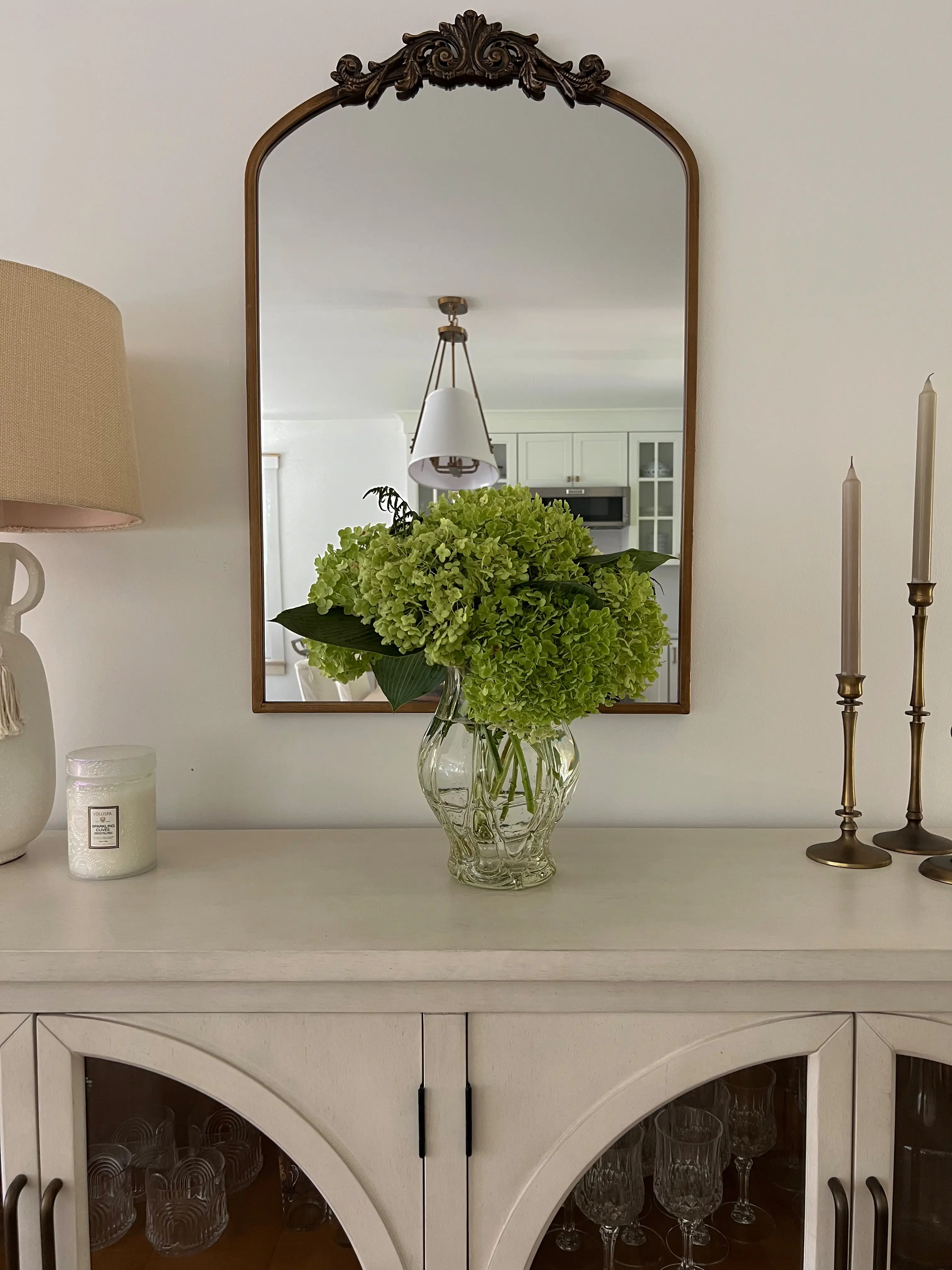flowers and candle on buffet in Alexa Mellardo's table