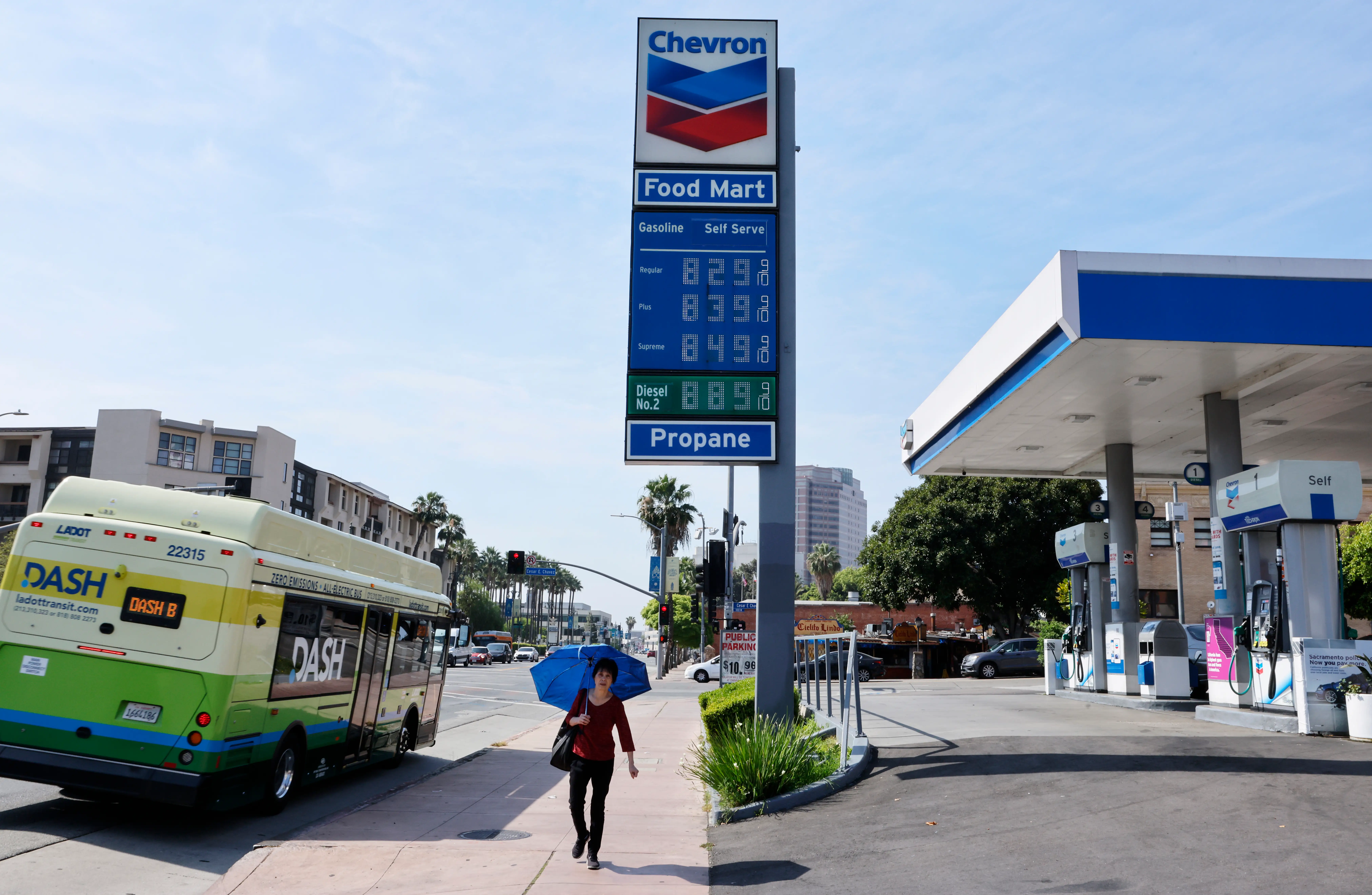 a gas station shows prices above $8
