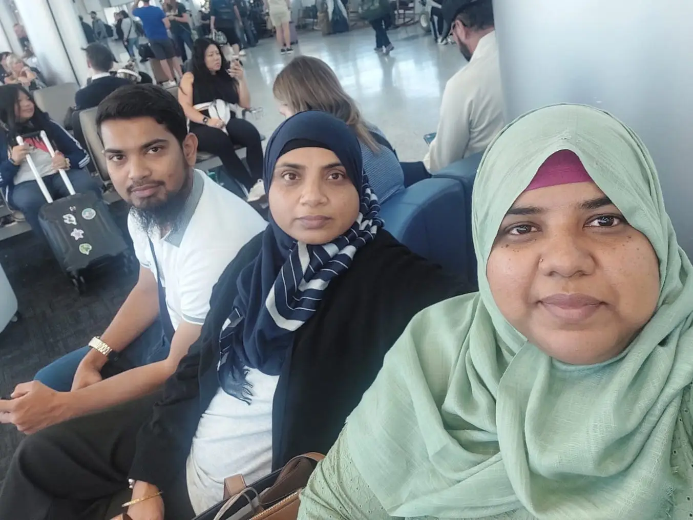 Ariba Mobin and her siblings sitting in an airport