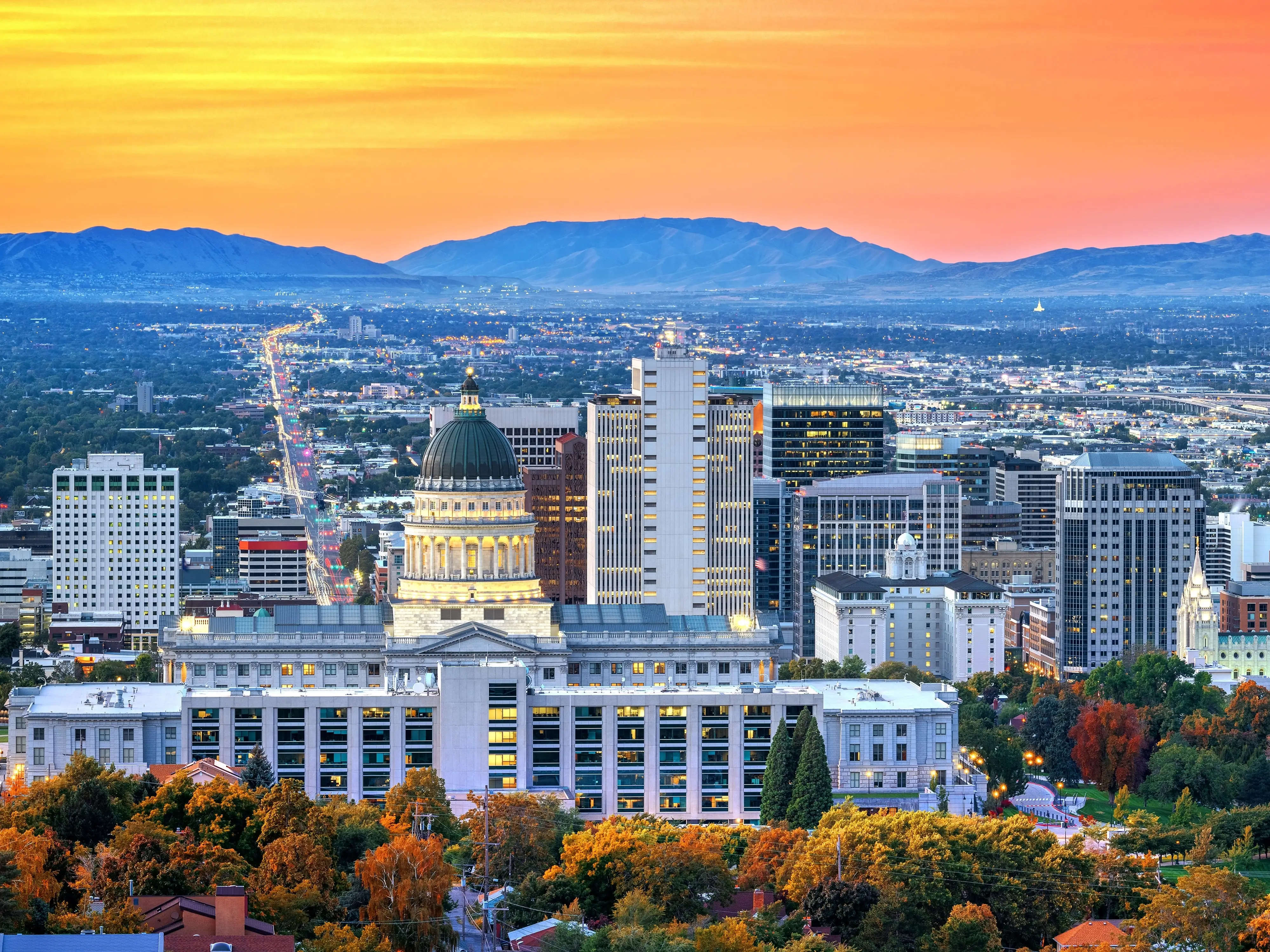 Capitol building in front of the skyline of Salt Lake City, Utah.