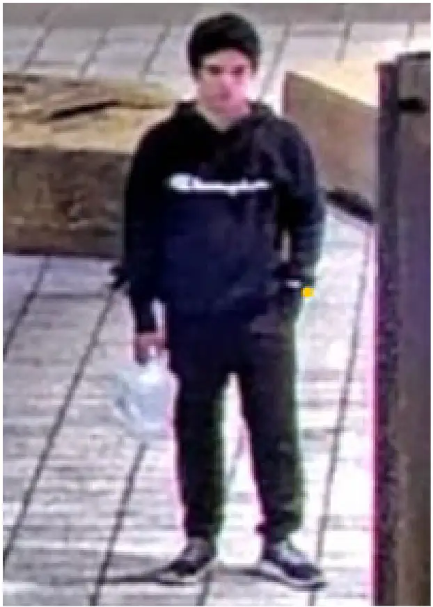 A fuzzy image of a man with a kerosene can