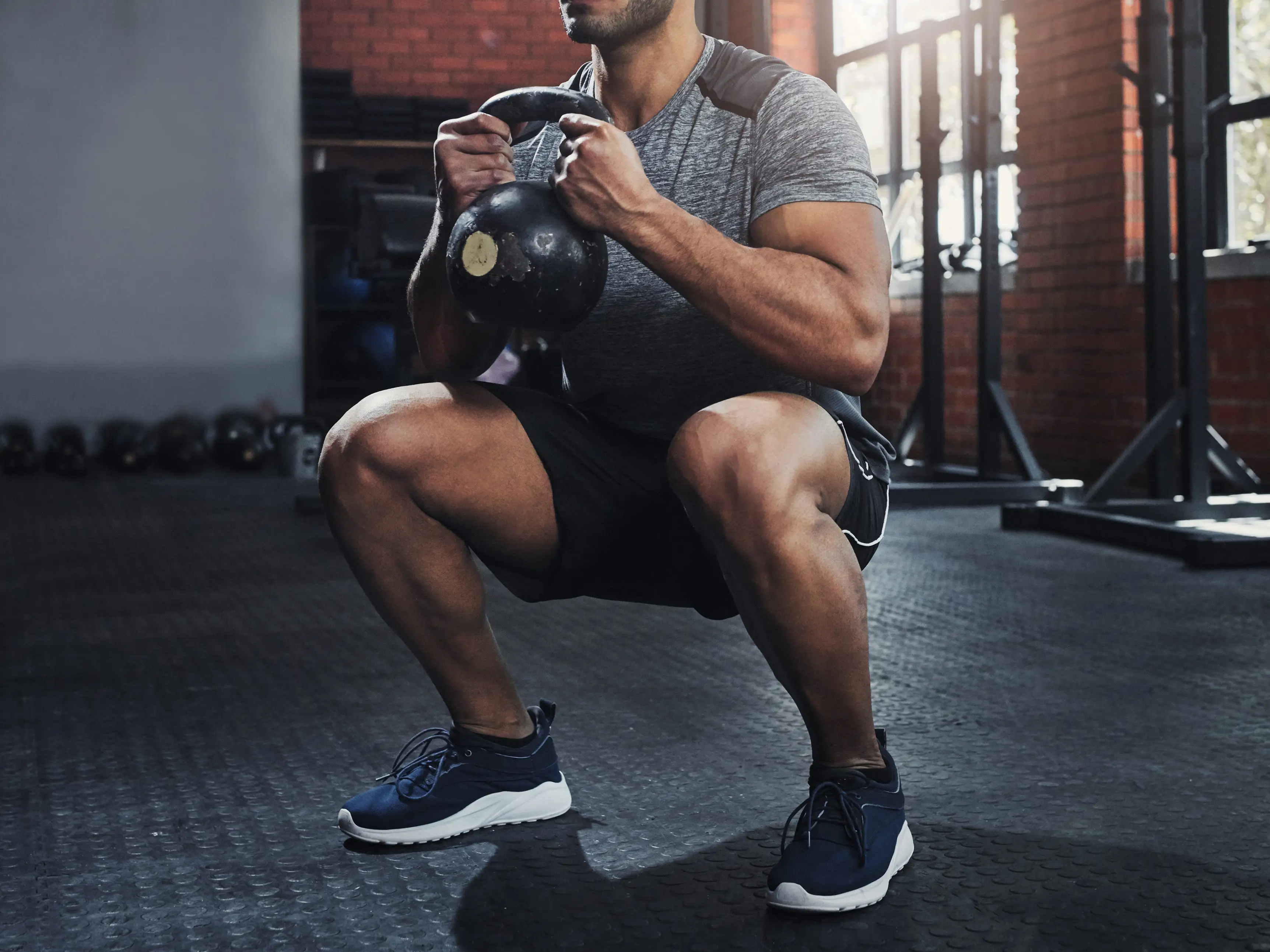 Man doing goblet squat