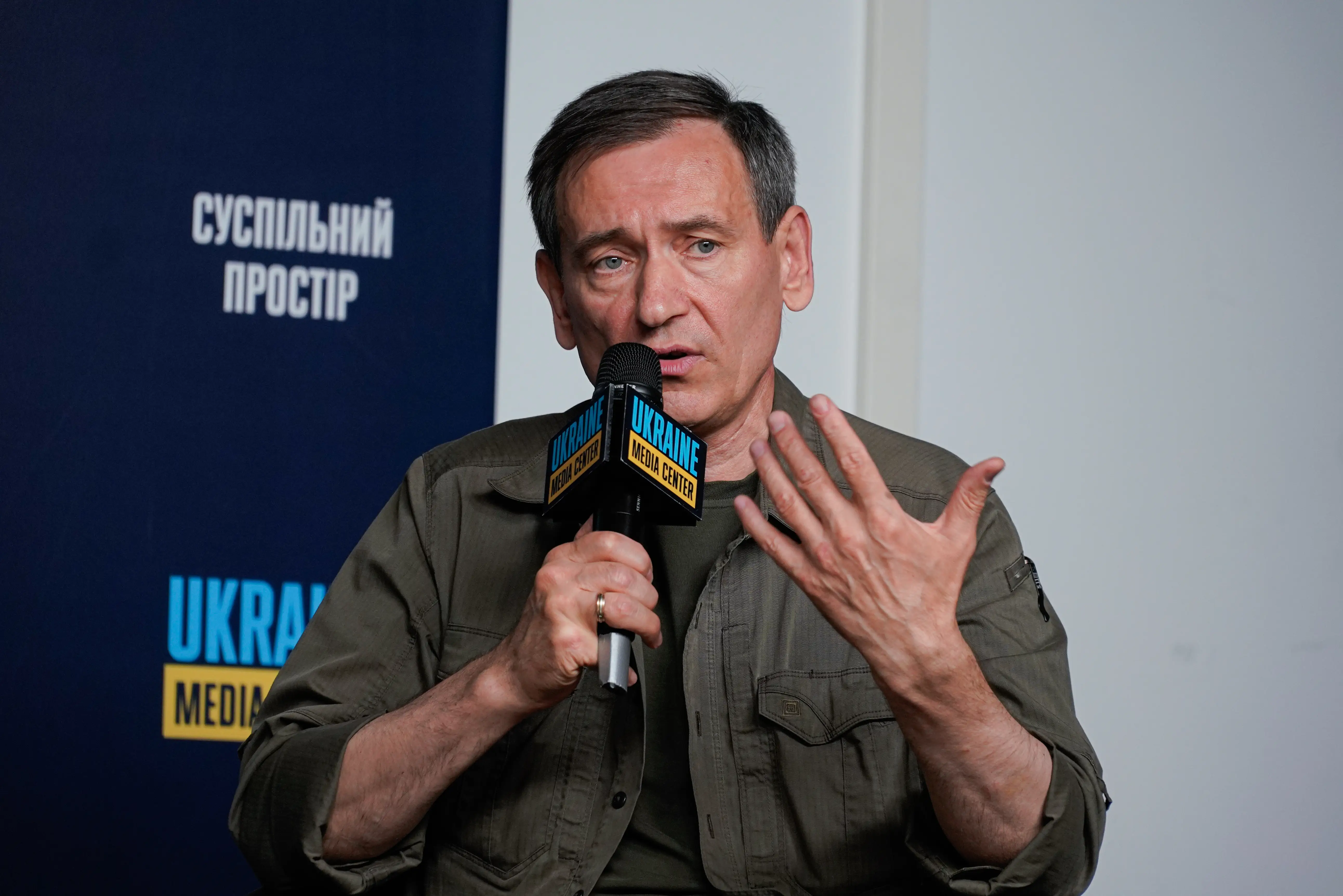 Fedir Venislavskyi speaks with a microphone.