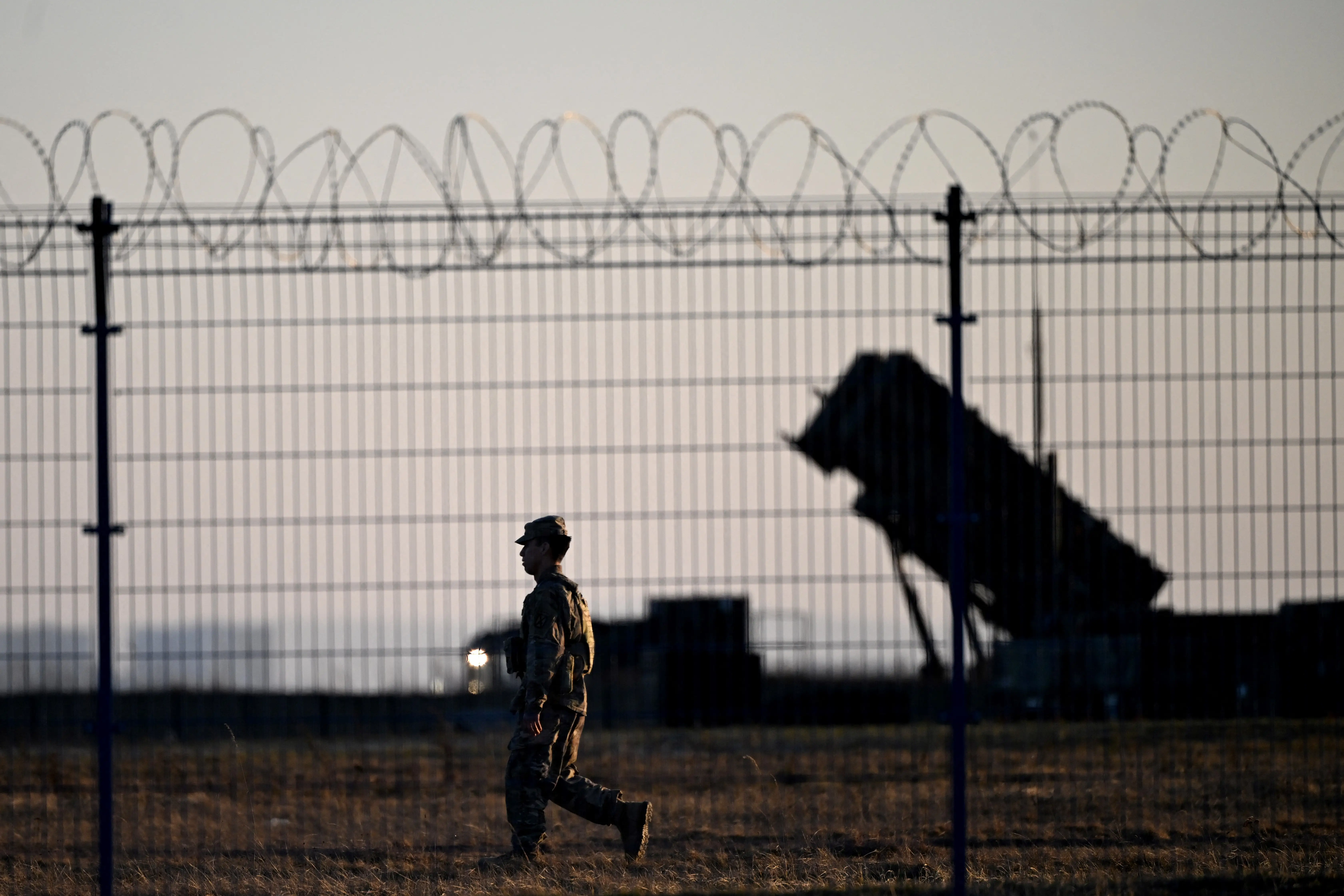 A soldier walks past Patriot air defense systems installed at the military hub for Ukraine at the Rzeszów-Jasionka airport, in Jasionka, south-east Poland, on March 6, 2025.