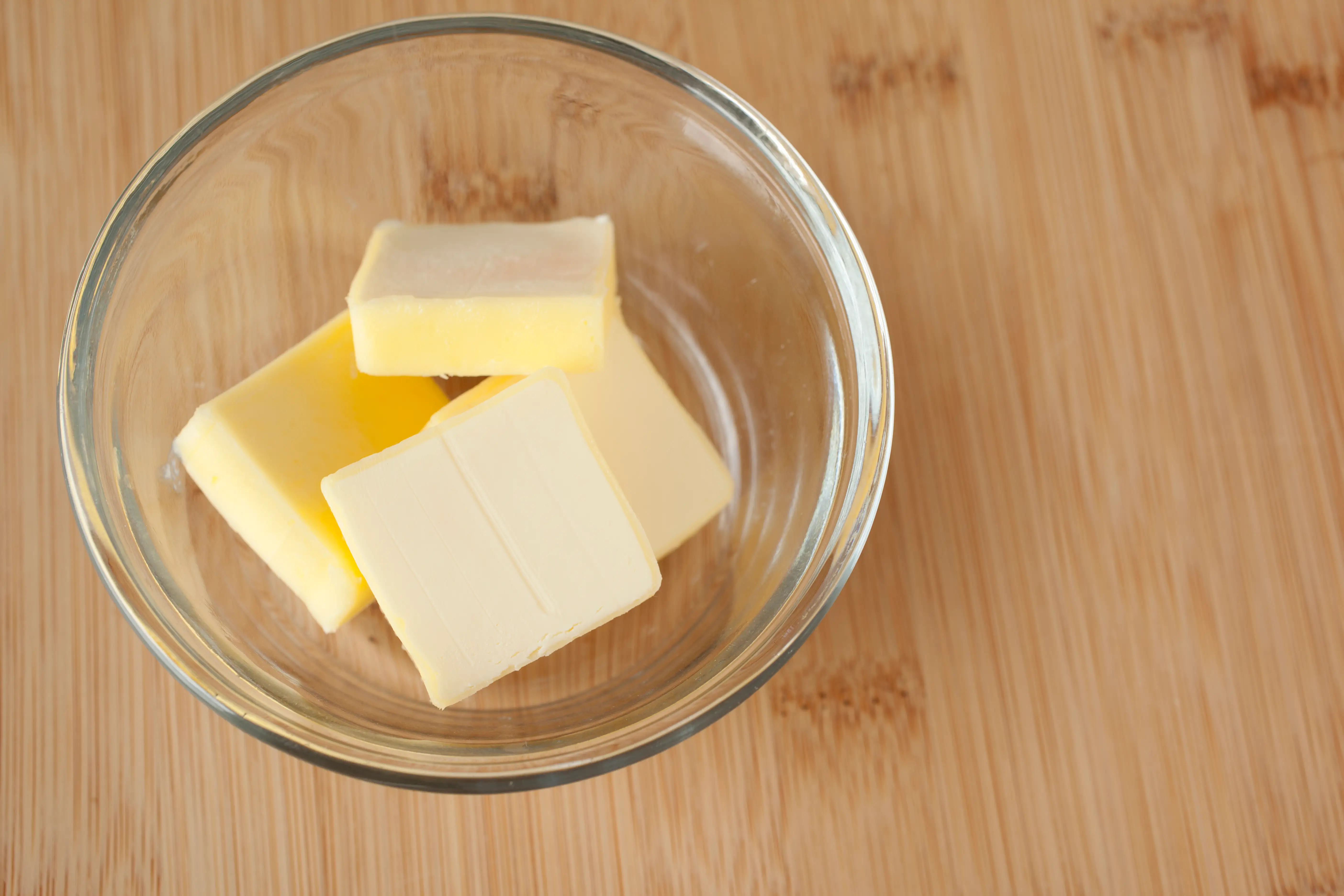 slices of butter in glass bowl