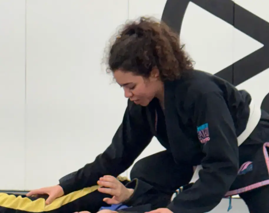 The writer practicing Brazilian jiu-jitsu at the gym.