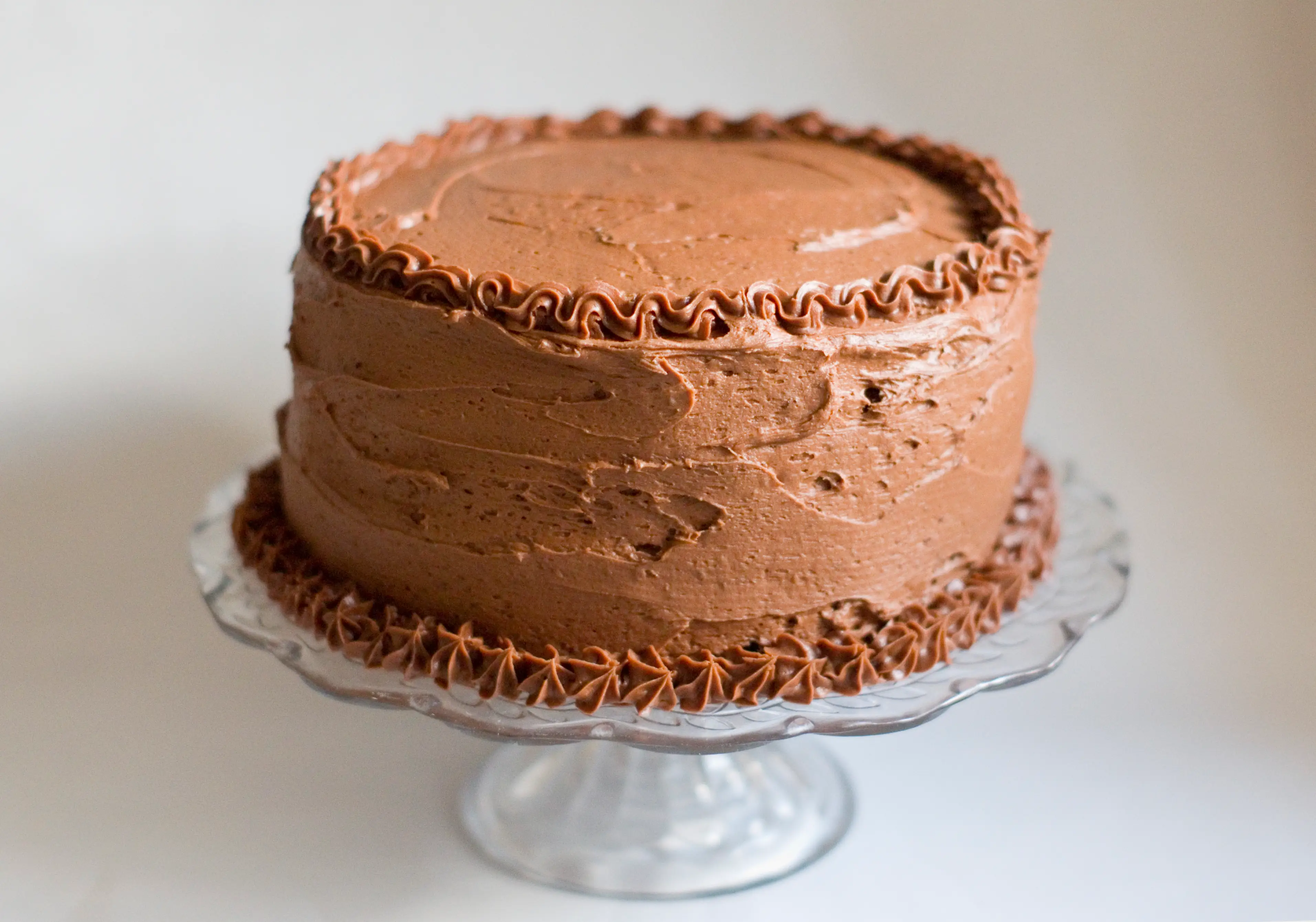 Cake frosted with chocolate frosting, piped edges