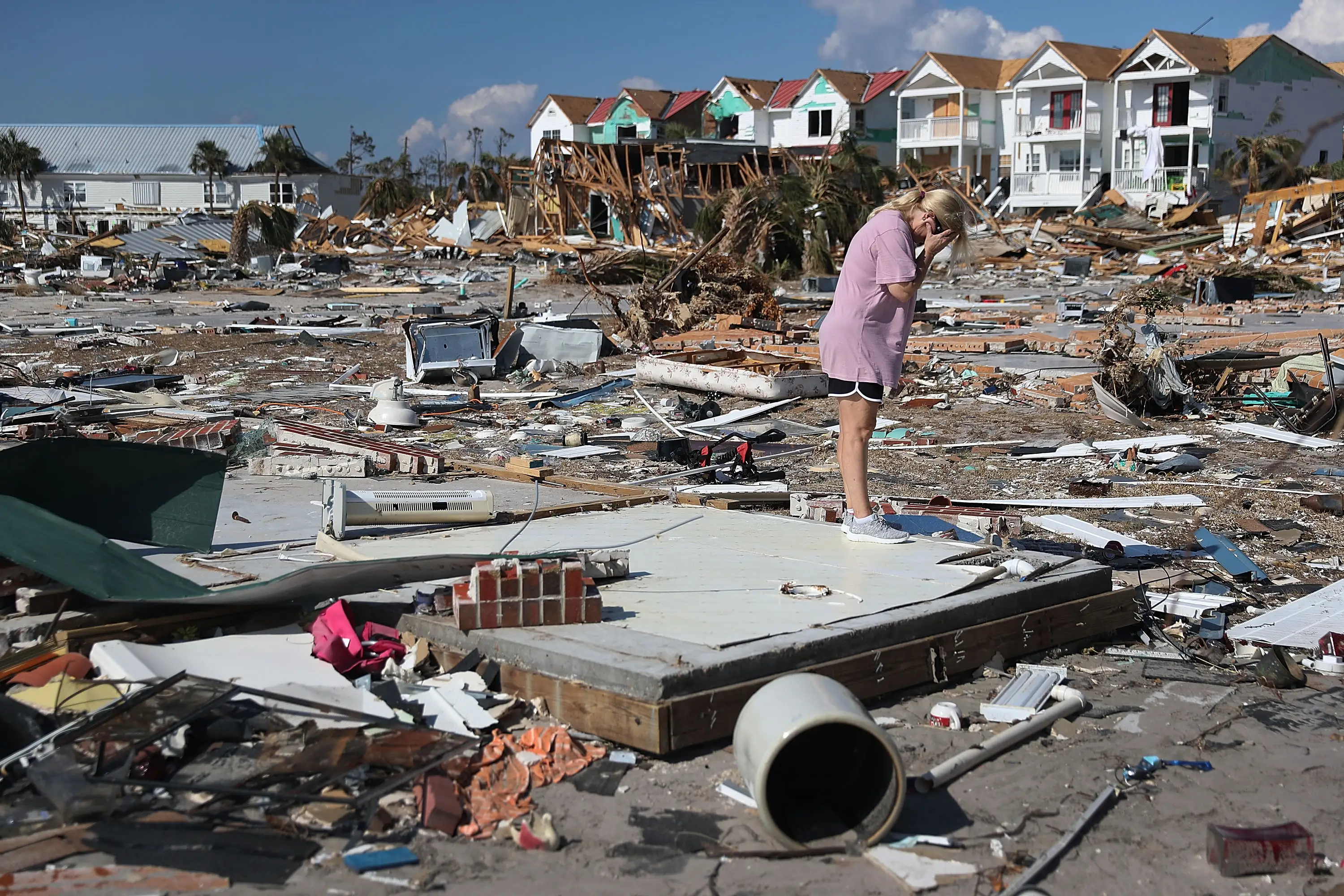 A woman is overcome with emotion as she visits the remains of her home to see if she can salvage anything after it was destroyed by Hurricane Michael as it passed through the area on October 15, 2018 in Mexico Beach, Florida.