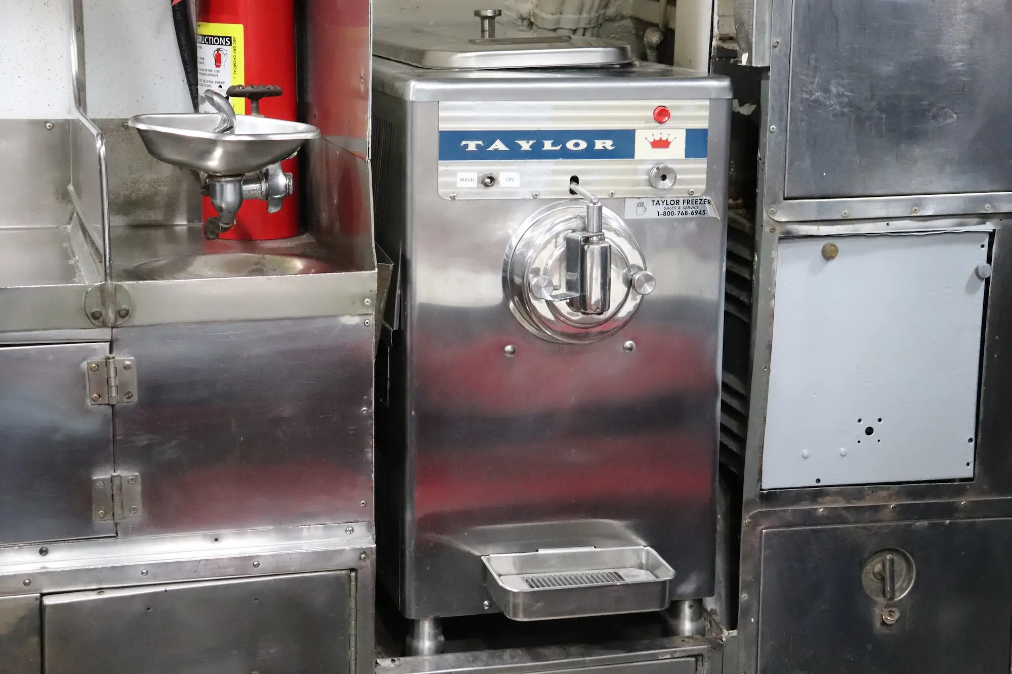 A soft-serve ice cream machine in the crew's mess on the USS Torsk.