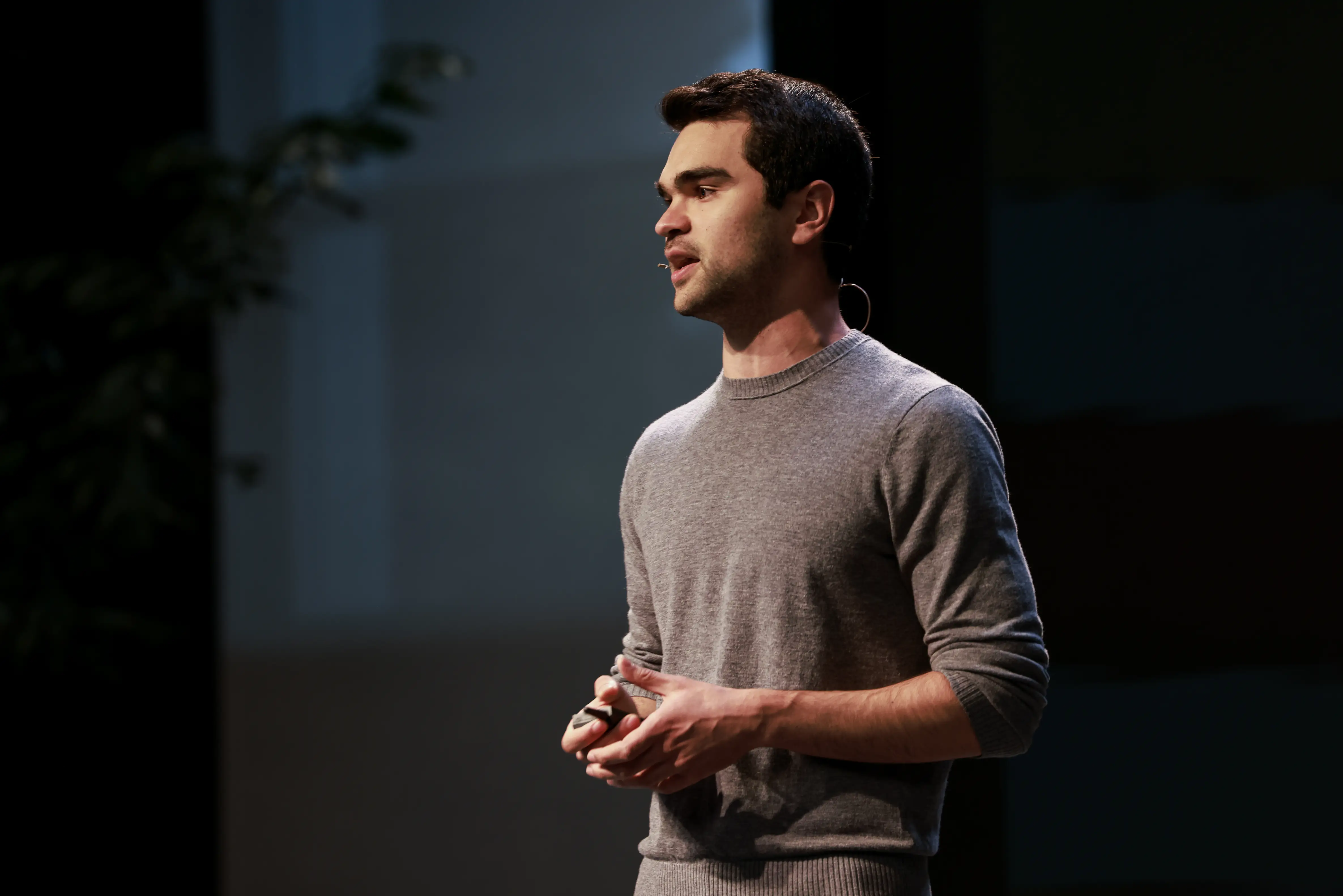 Ahmed Ahres presenting on a stage