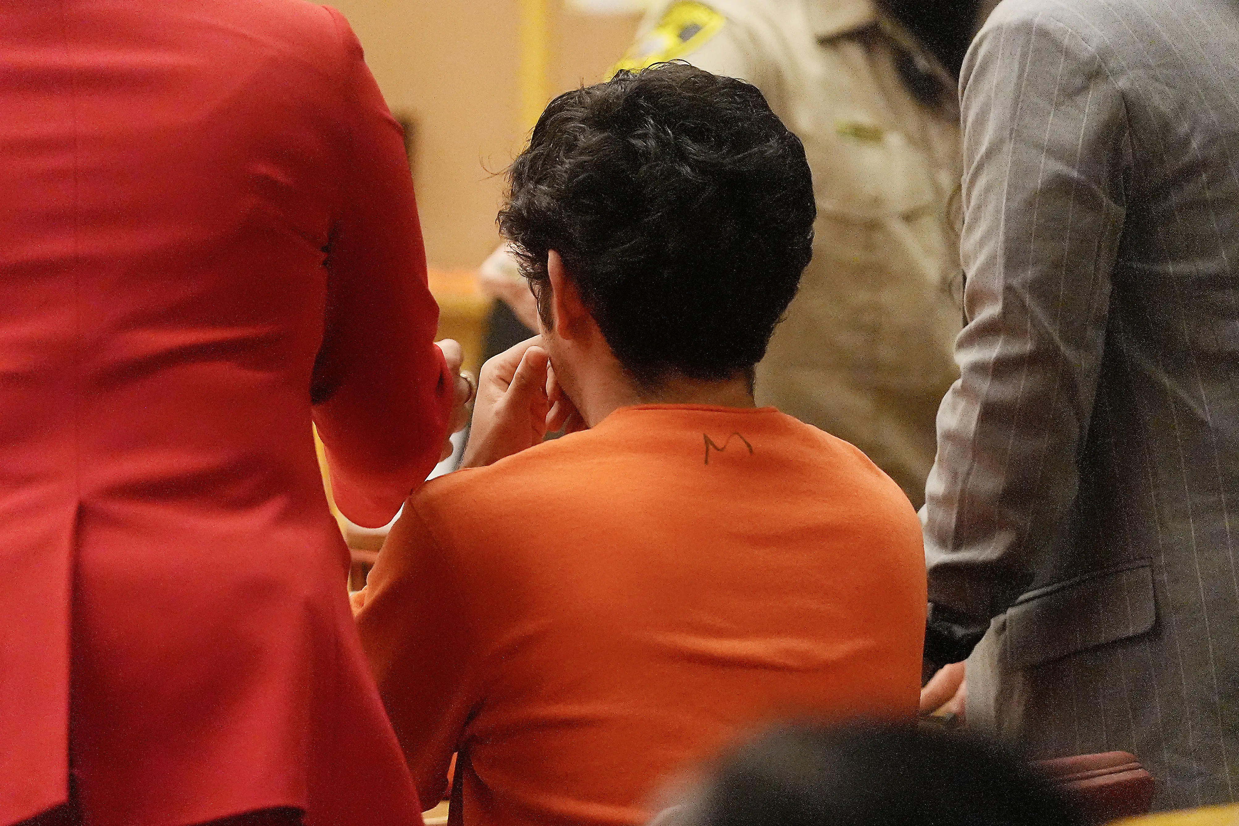 Daniel Moreno-Gama, middle, appears in court with public defenders Diamond Ward, left, and Nuha Abusamra on Tuesday, April 14, 2026, in San Francisco.