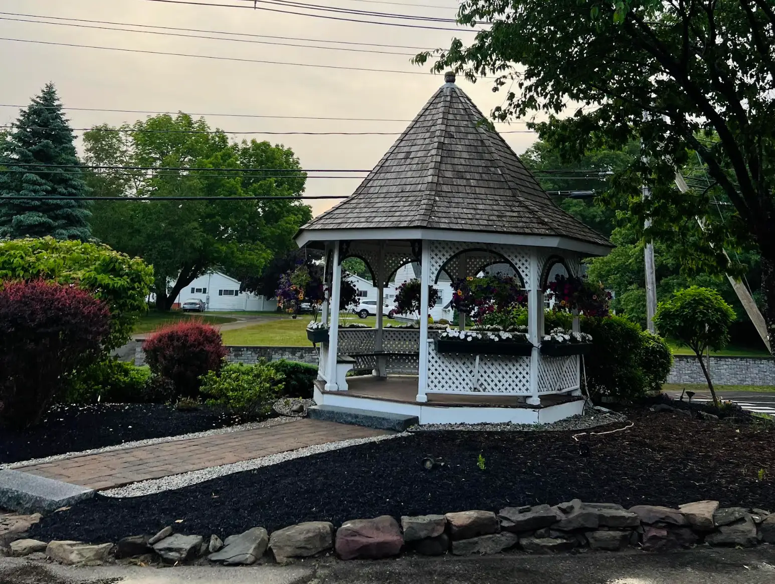 A gazebo with many flowers at the Gazebo Inn in Ogunquit, Maine.