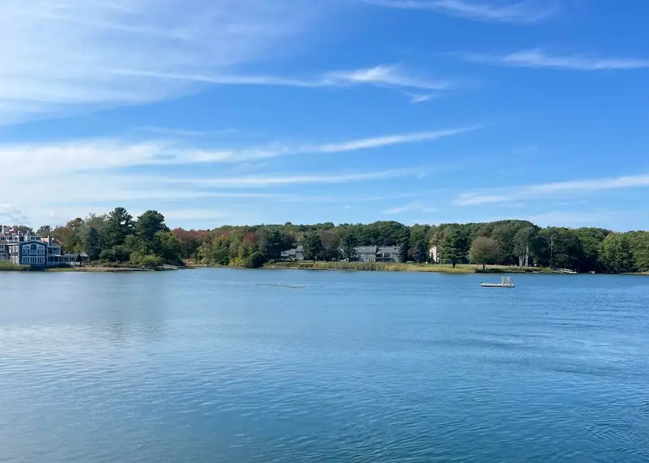 An expanse of blue water and some houses in Kennebunkport, Maine.