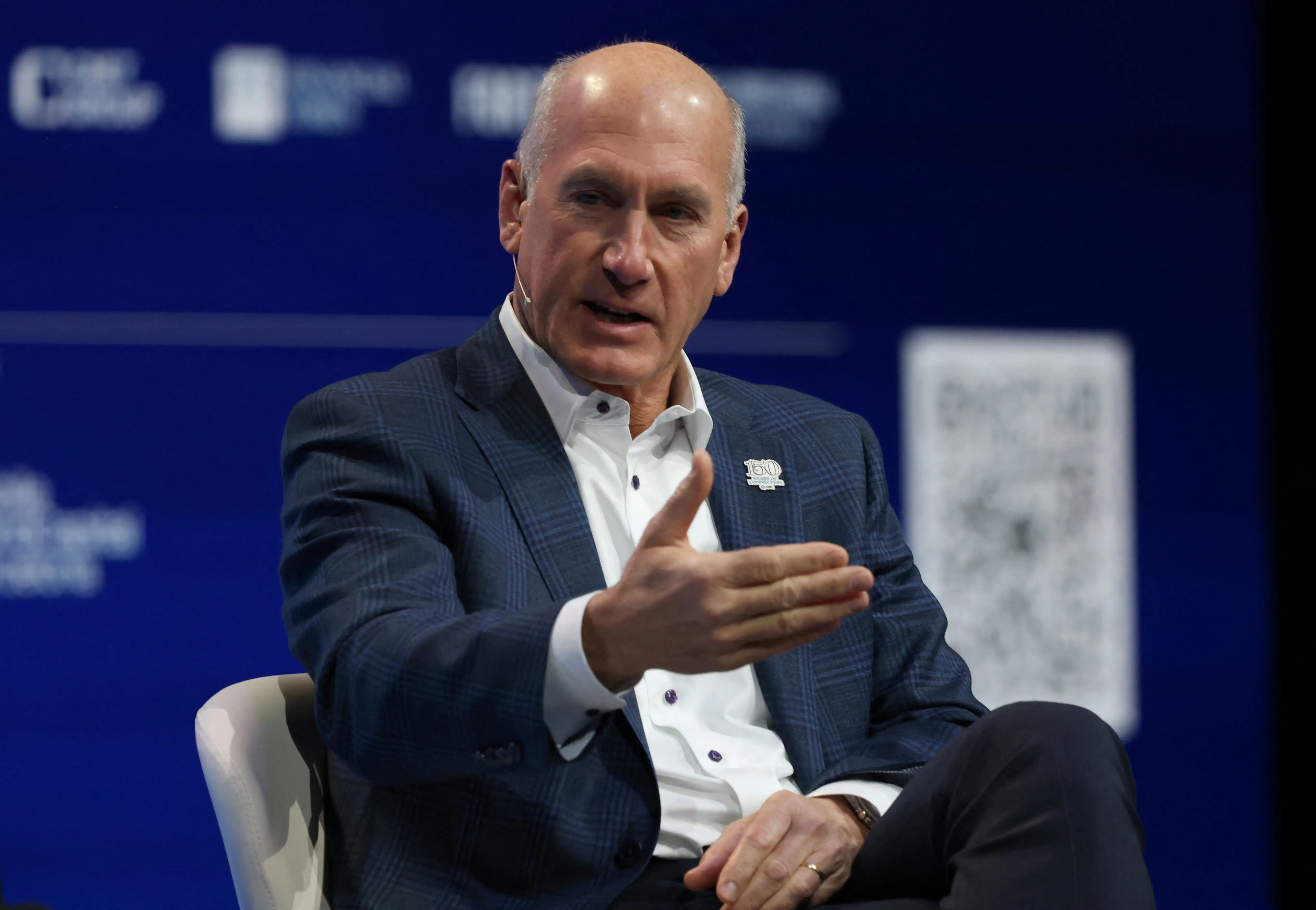 AT&T Chairman and CEO John Stankey talks on stage during the inauguration of the Mobile World Congress (MWC), the world's biggest mobile technology showcase and fair, on March 2, 2026 in Barcelona.
