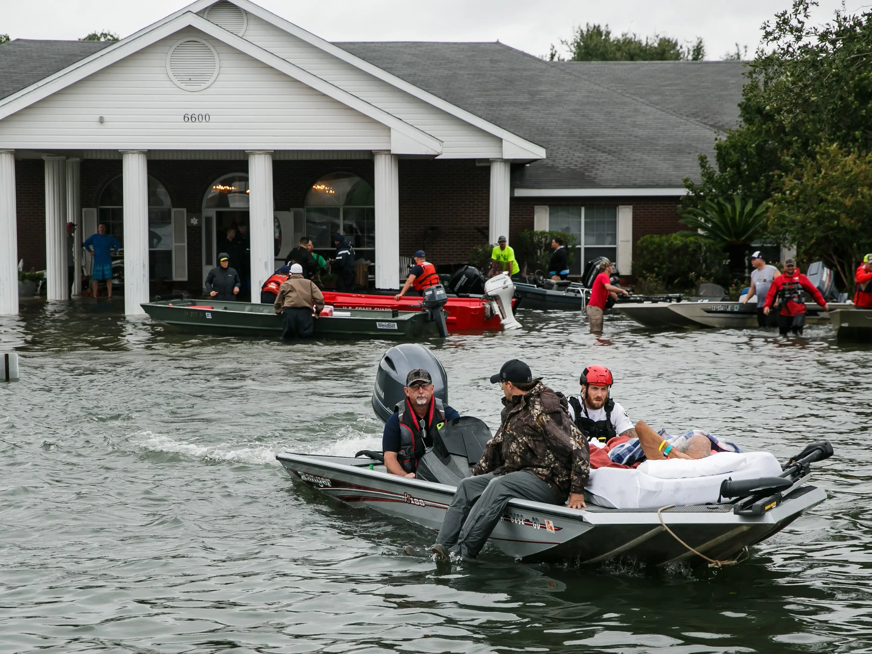 Search and rescue volunteers rescue patients from the Cypress Glen nursing home engulf in floodwater in Port Arthur, Texas, on Aug. 30, 2017.