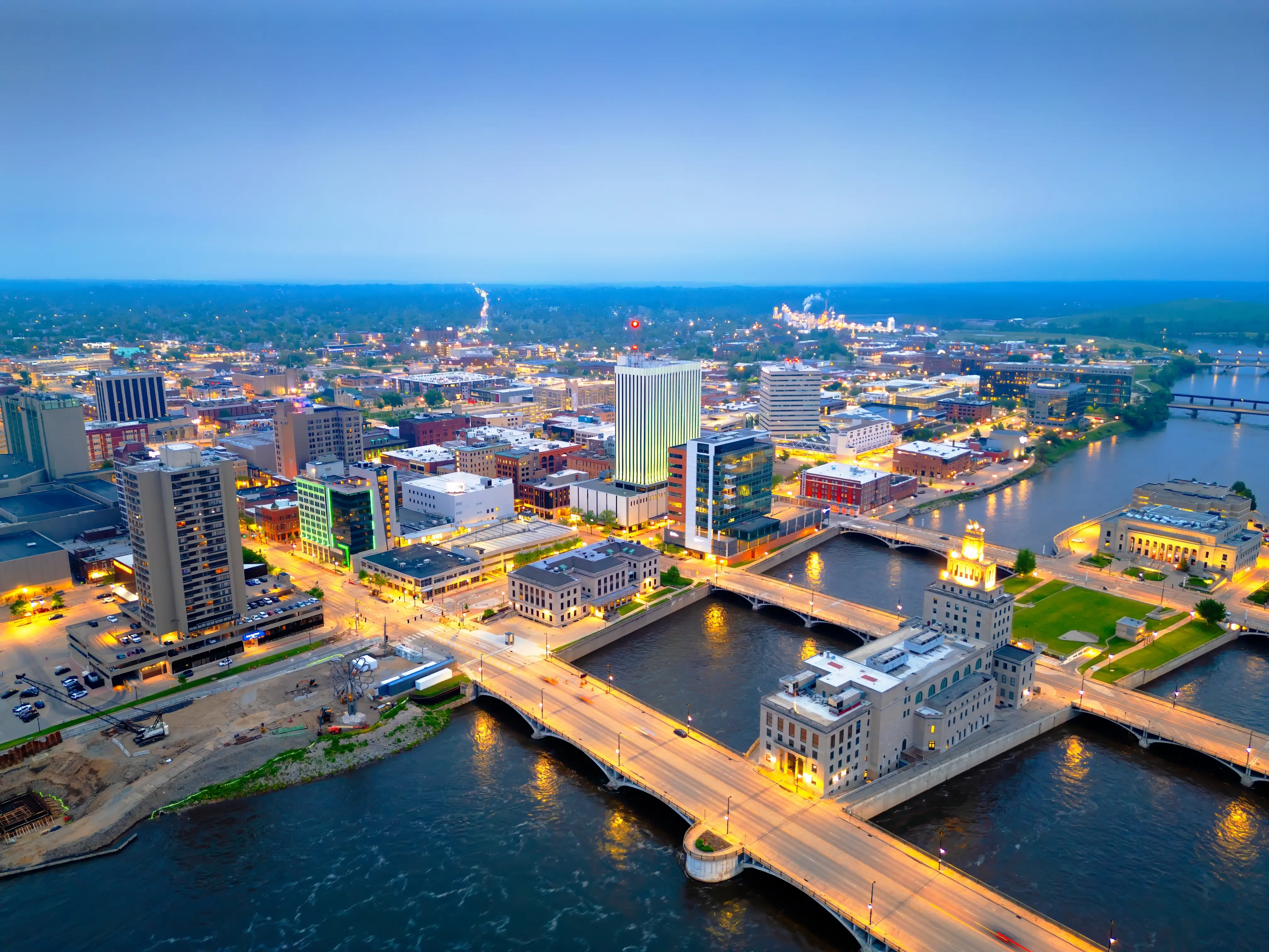 Cedar Rapids, Iowa, USA cityscape on the Cedar River at dusk.