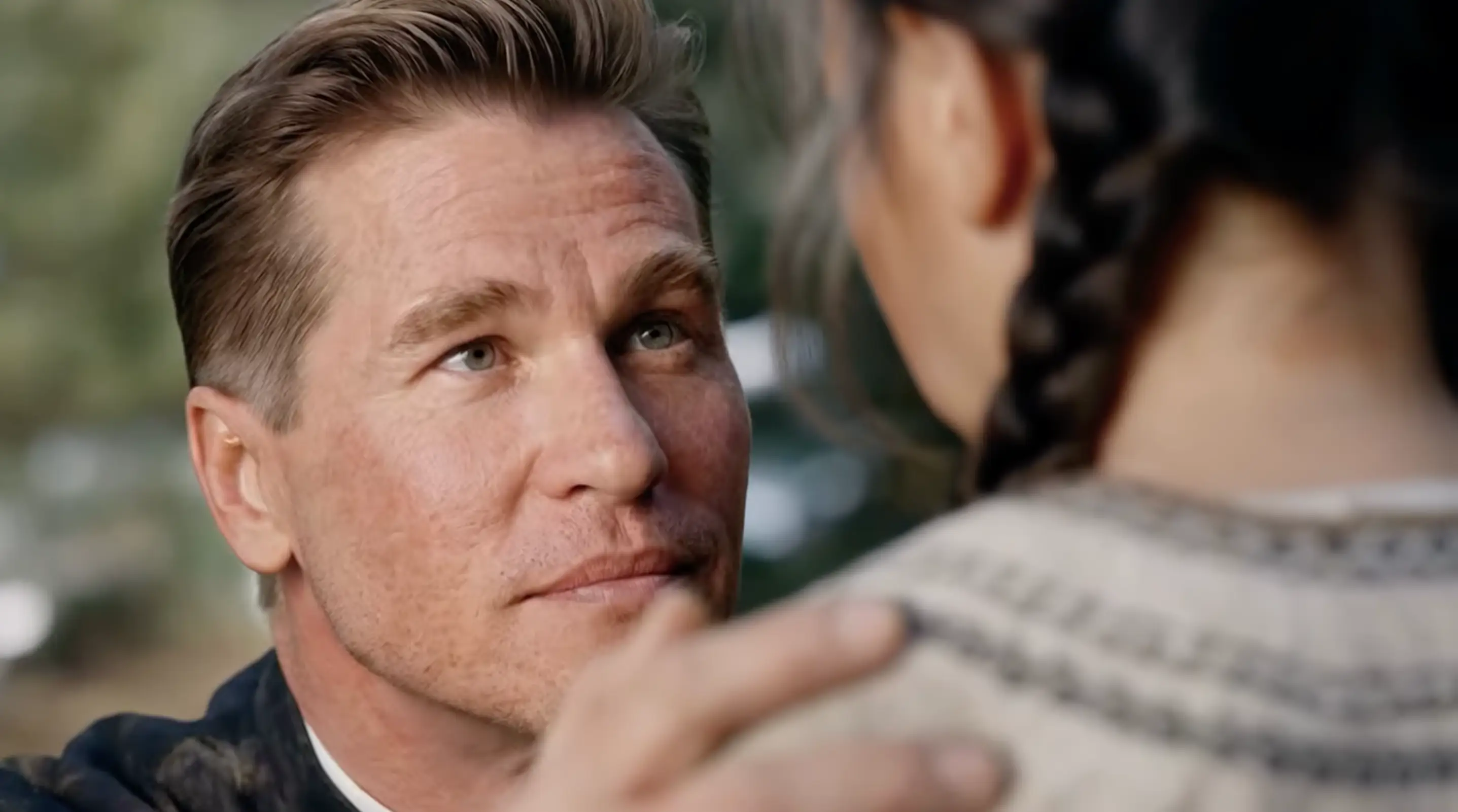 Val Kilmer looking at a child in the movie As Deep as the Grave