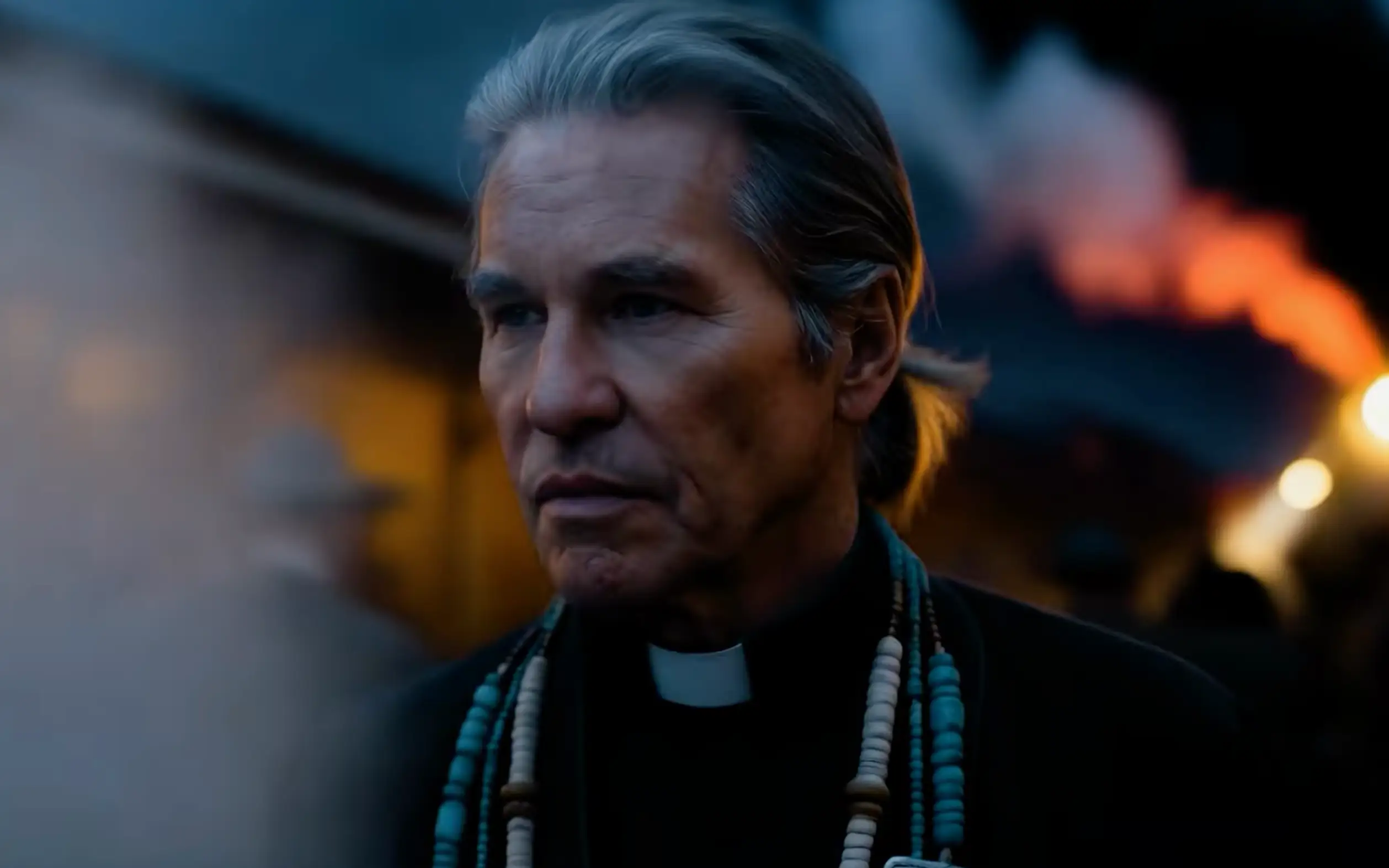 Val Kilmer dressed as a priest in As Deep as the Grave movie