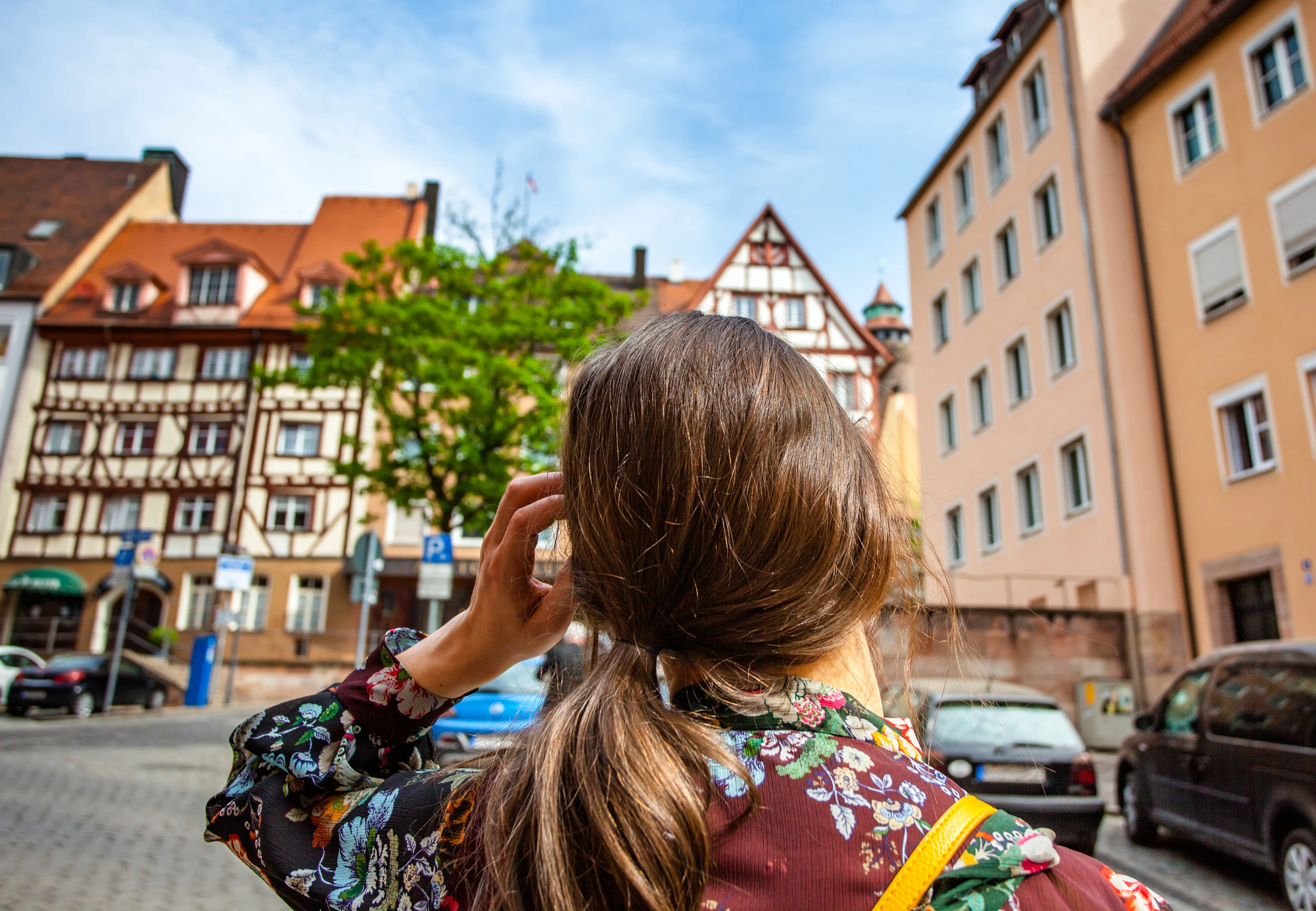 Back of woman in Germany looking at buildings
