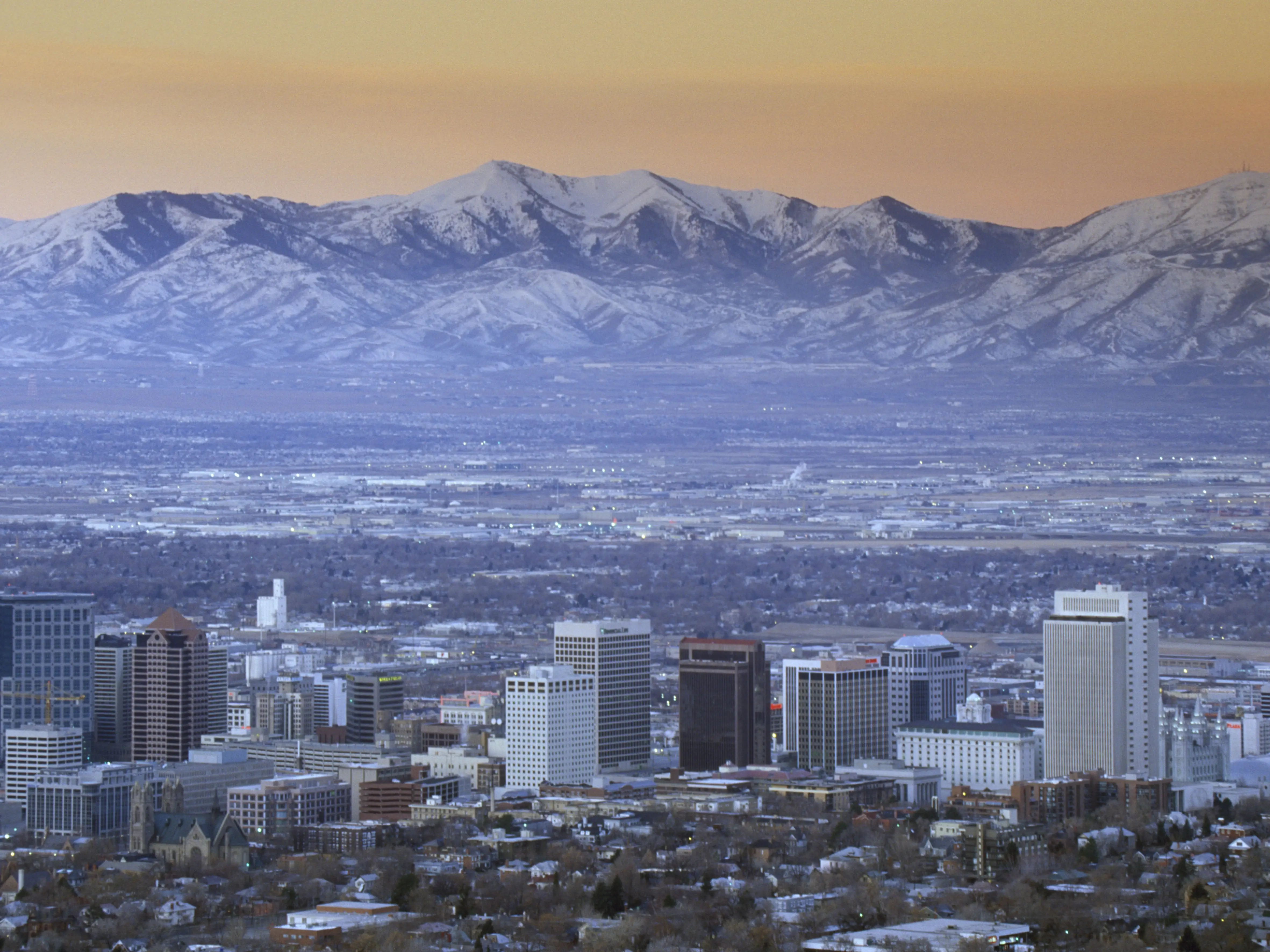 Skyline of Salt Lake City, UT with Snow capped Wasatch Mountains in background