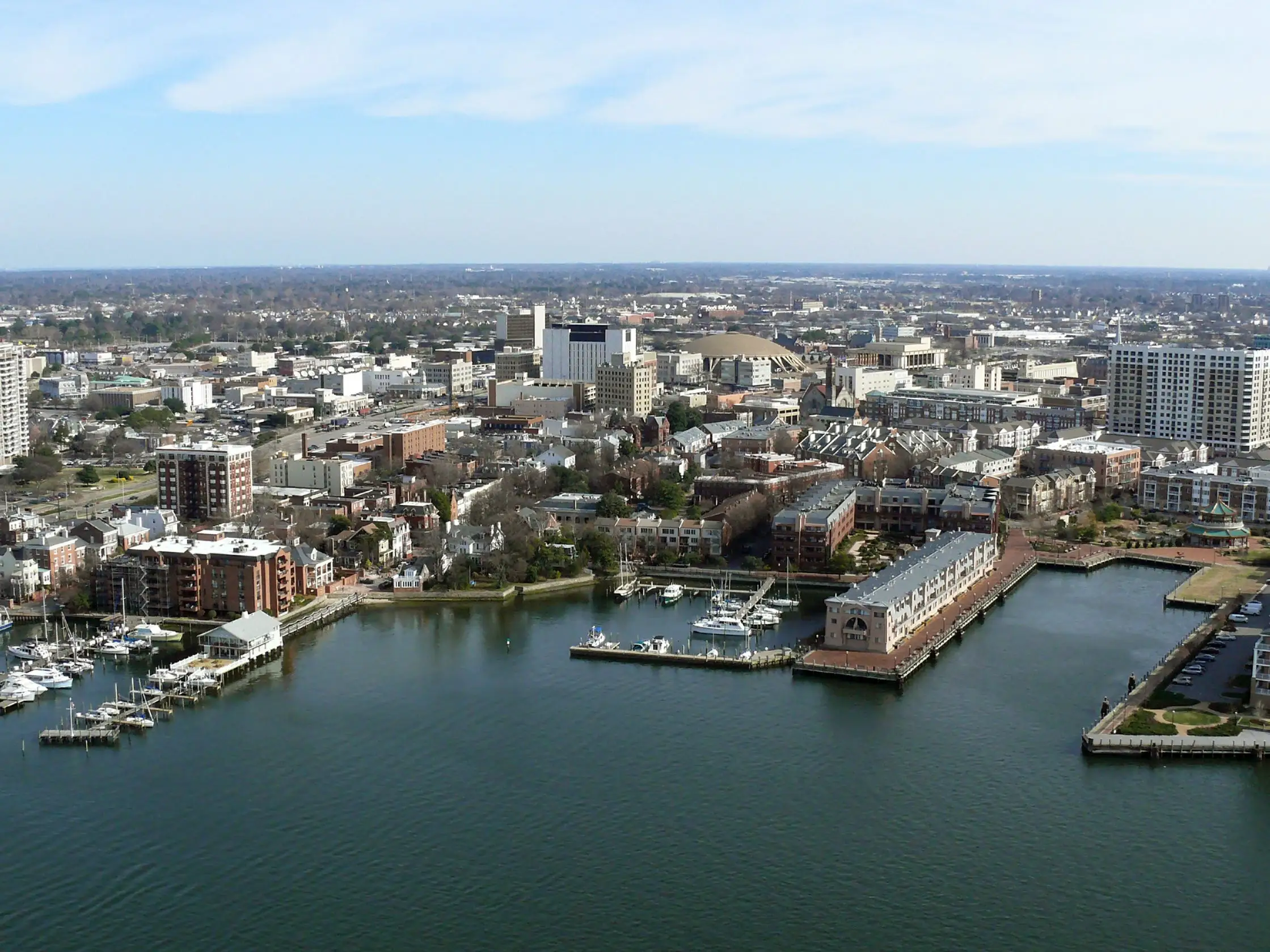 Aerial of Norfork Virginia's Chesapeak Bay shoreline, buildings and marinas.