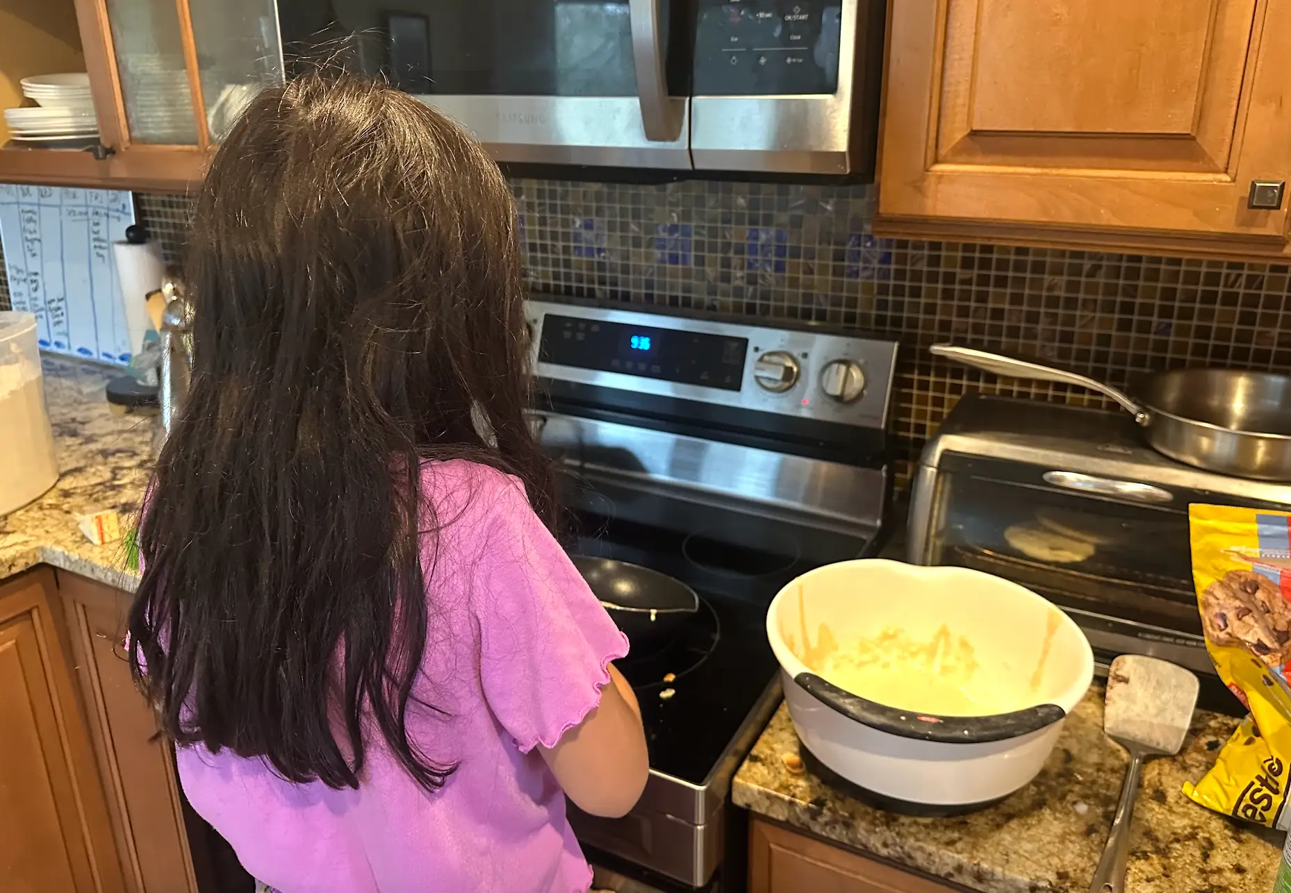 José R. Mendoza's daughter cooking pancakes