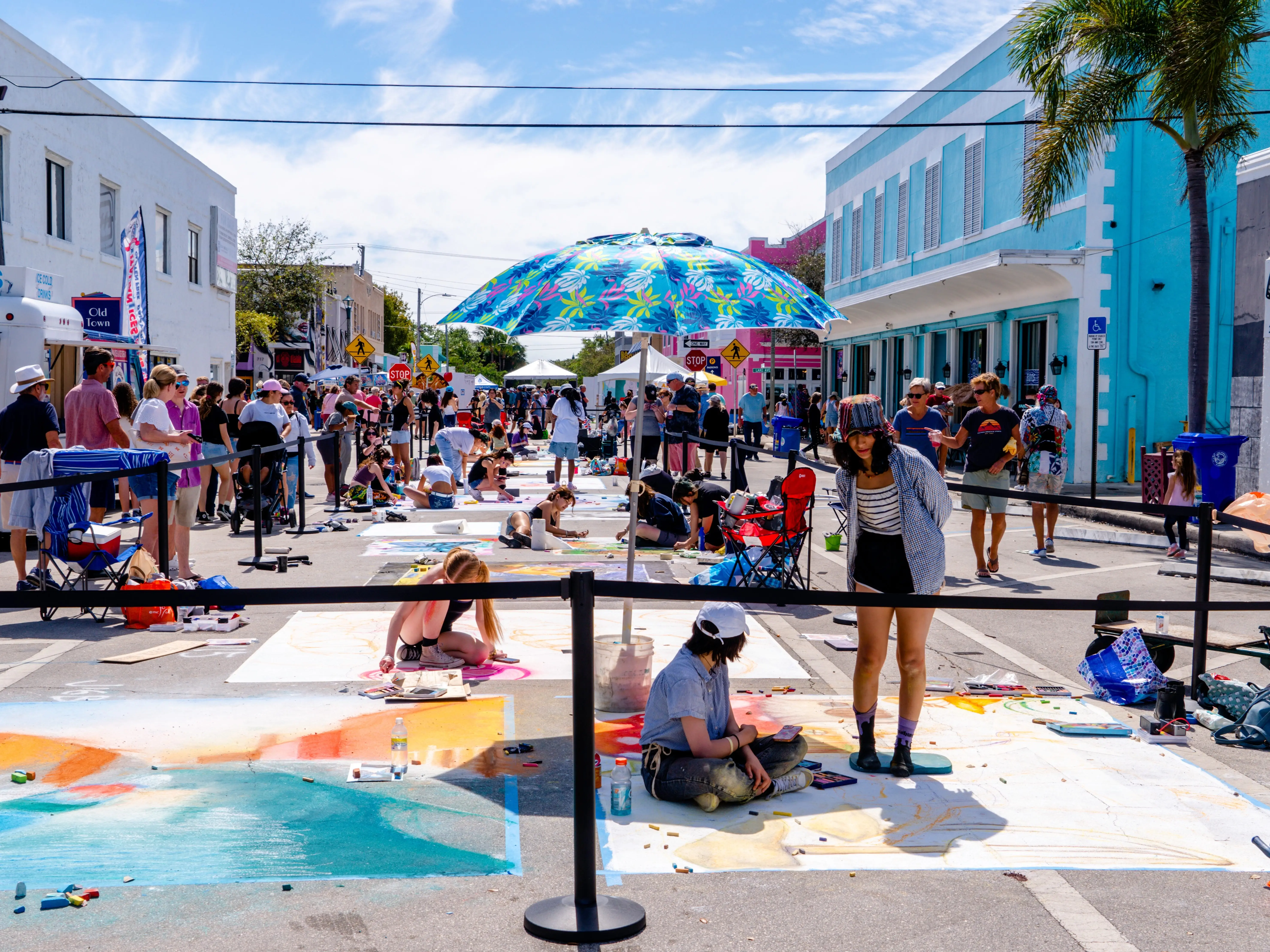 Artists paint on the street during a festival in Lake Worth Beach, Florida.