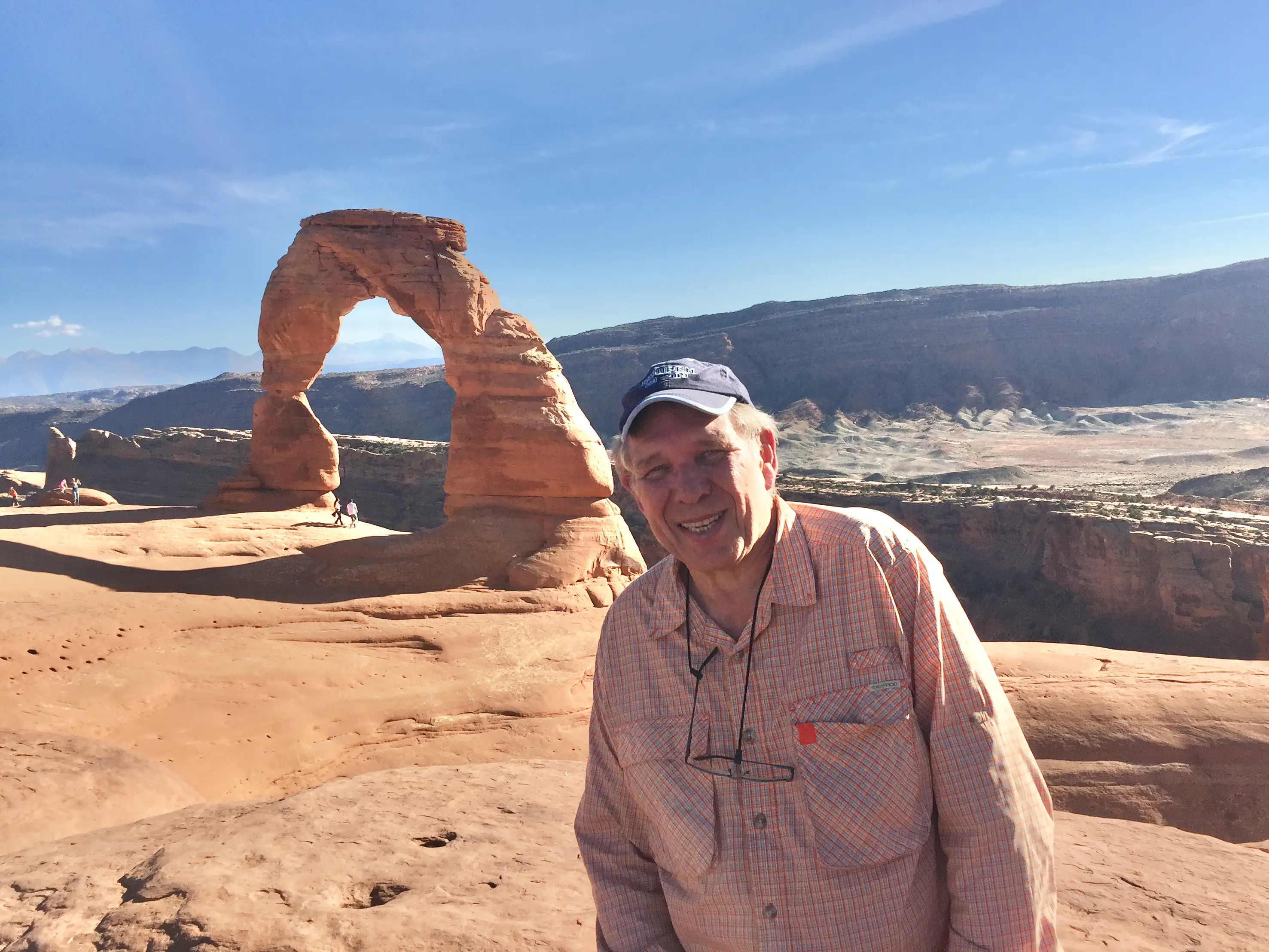 A man on a hike at the Arches National Park.