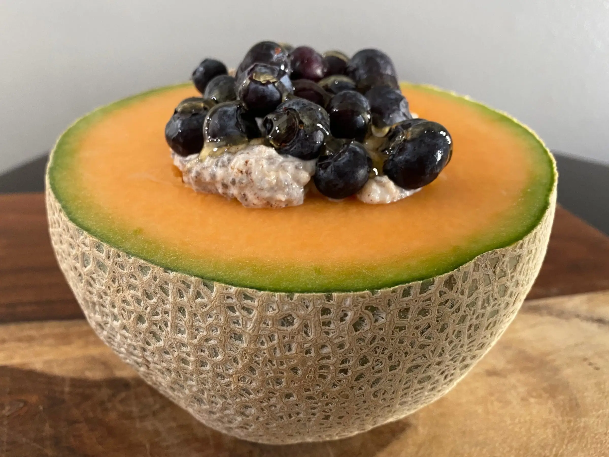 oats and blueberries in half a cantaloupe