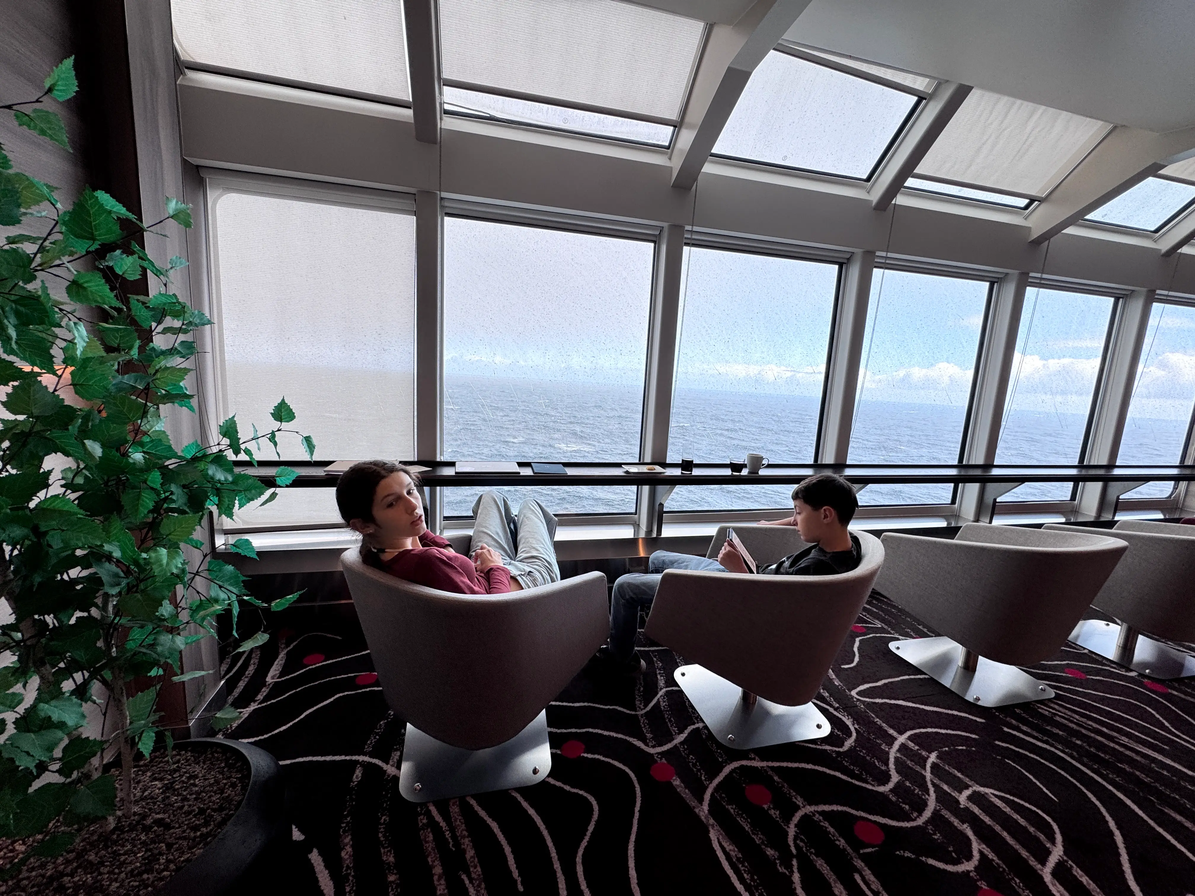 The author's kids relax on a boat in Antarctica.